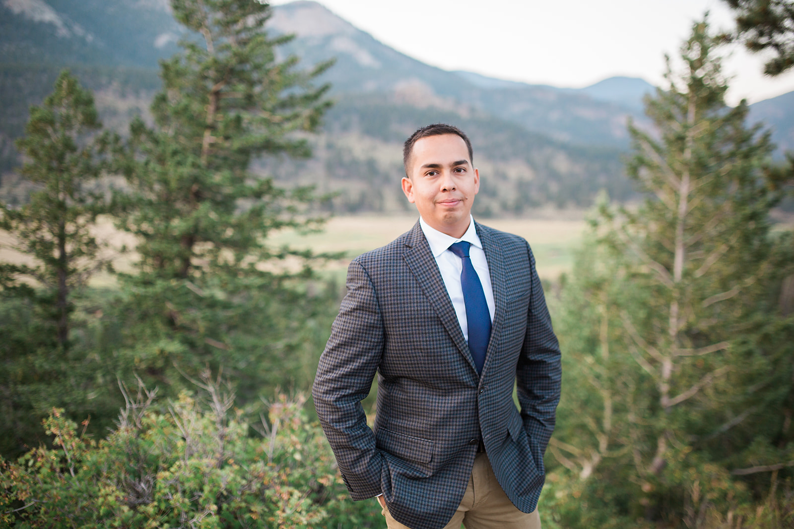 guy in plaid jacket in Rocky Mountains