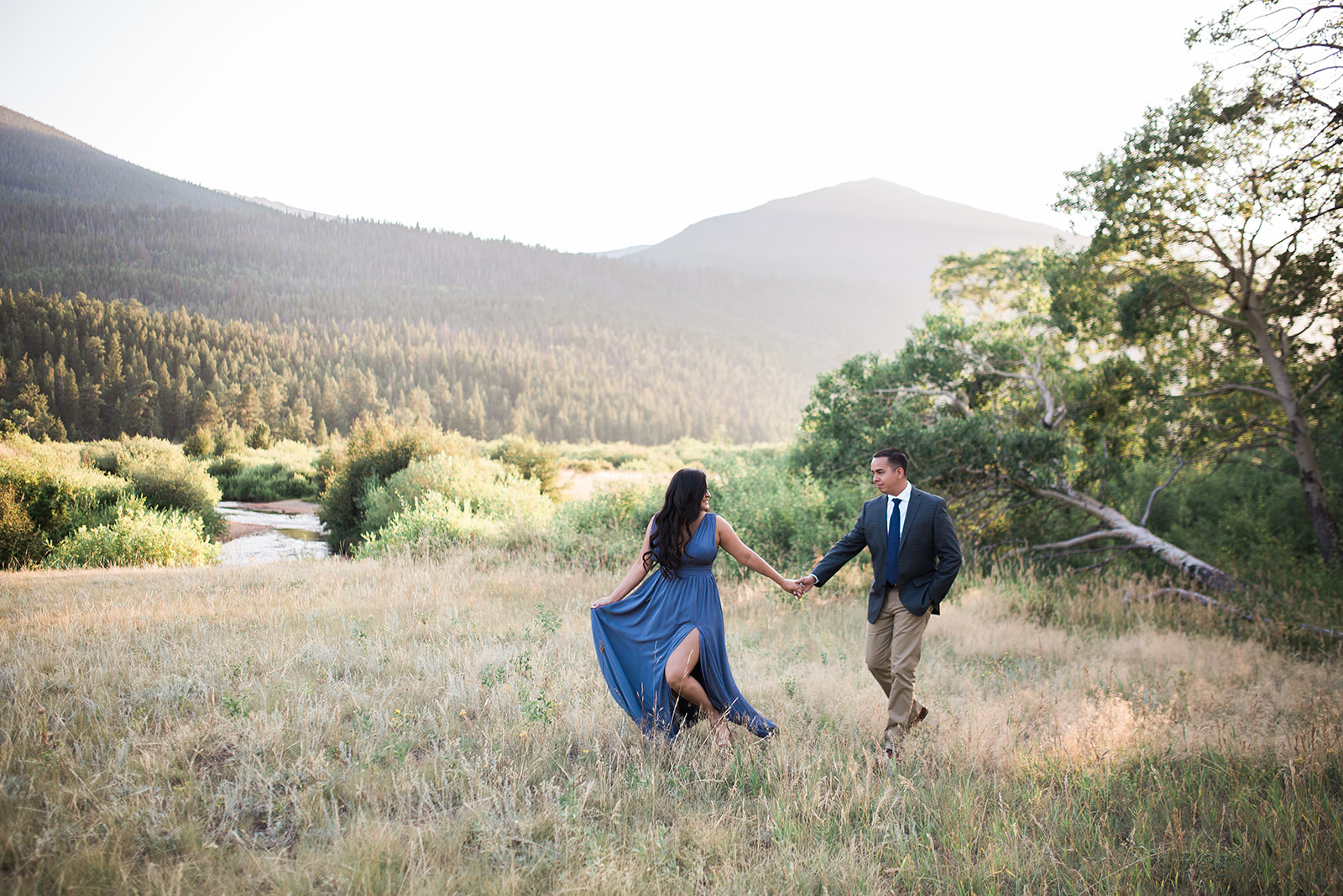 couple walking in Rocky Mountain sunset