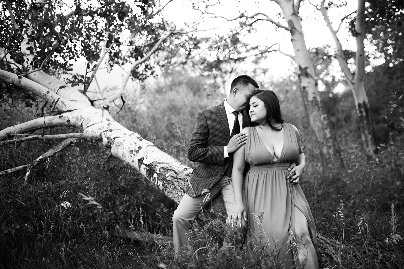 engaged couple posing in gorgeous Colorado mountains