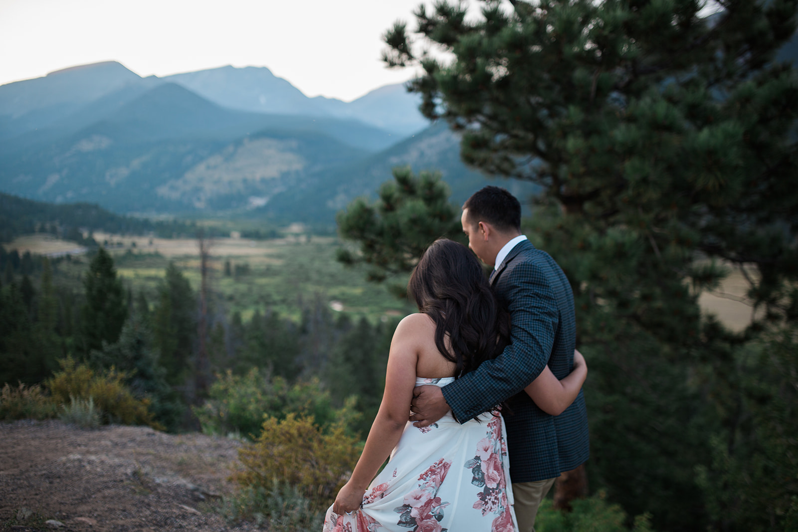 couple walks on trail in Rocky Mountain National Park