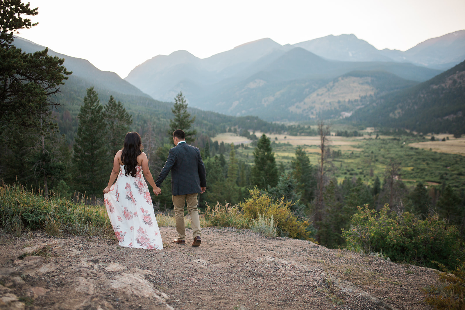 couple walks on trail in Rocky Mountain National Park