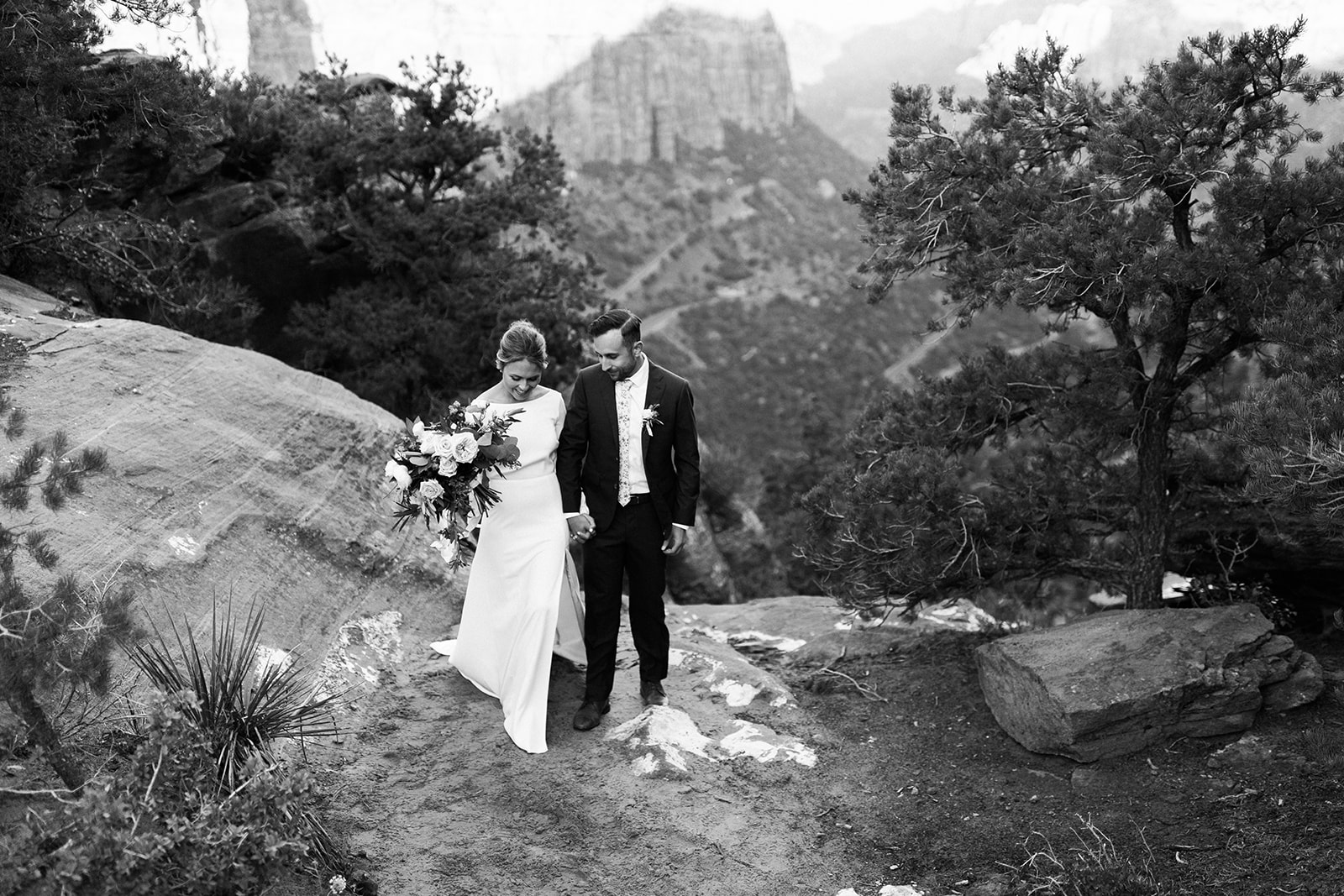 bride and groom walk to their elopement ceremony in Zion National Park