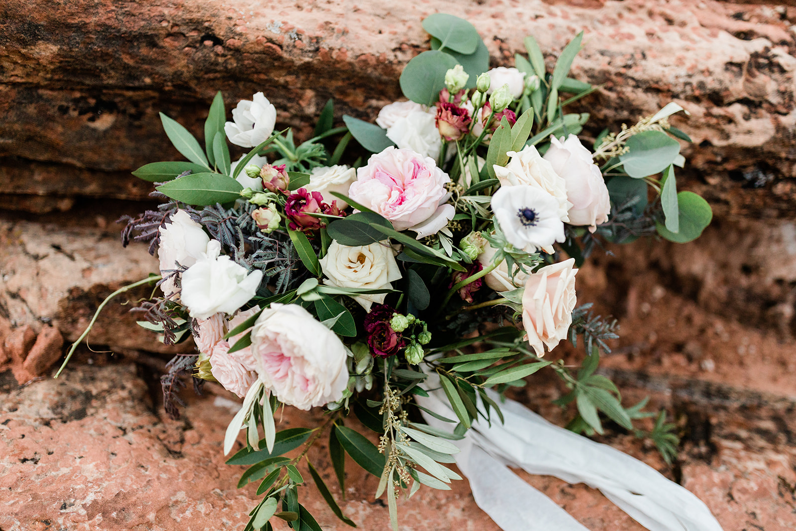 bride's bouquet for elopement against Zion's red rocks