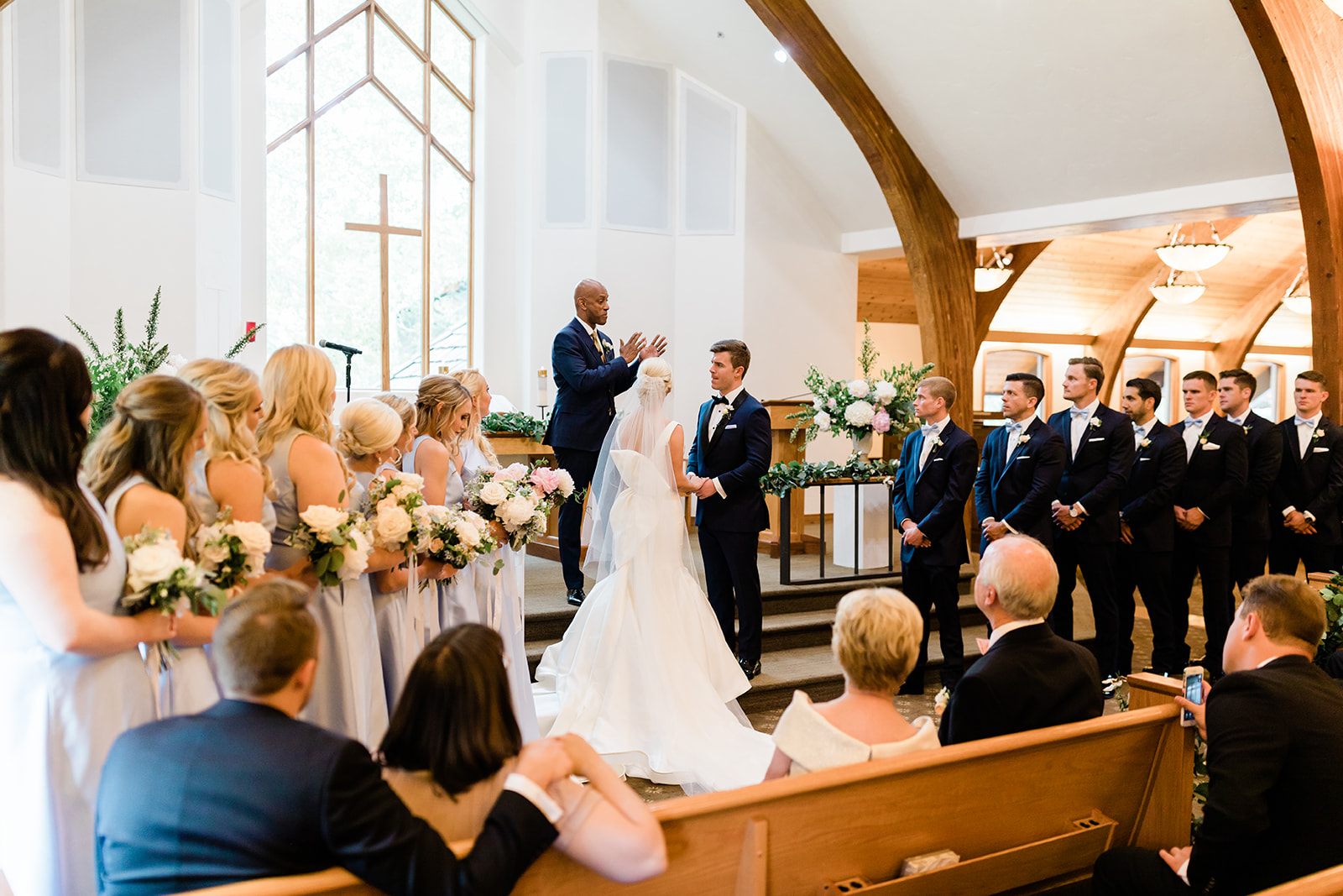 bride and groom at Vail church altar for mountain wedding