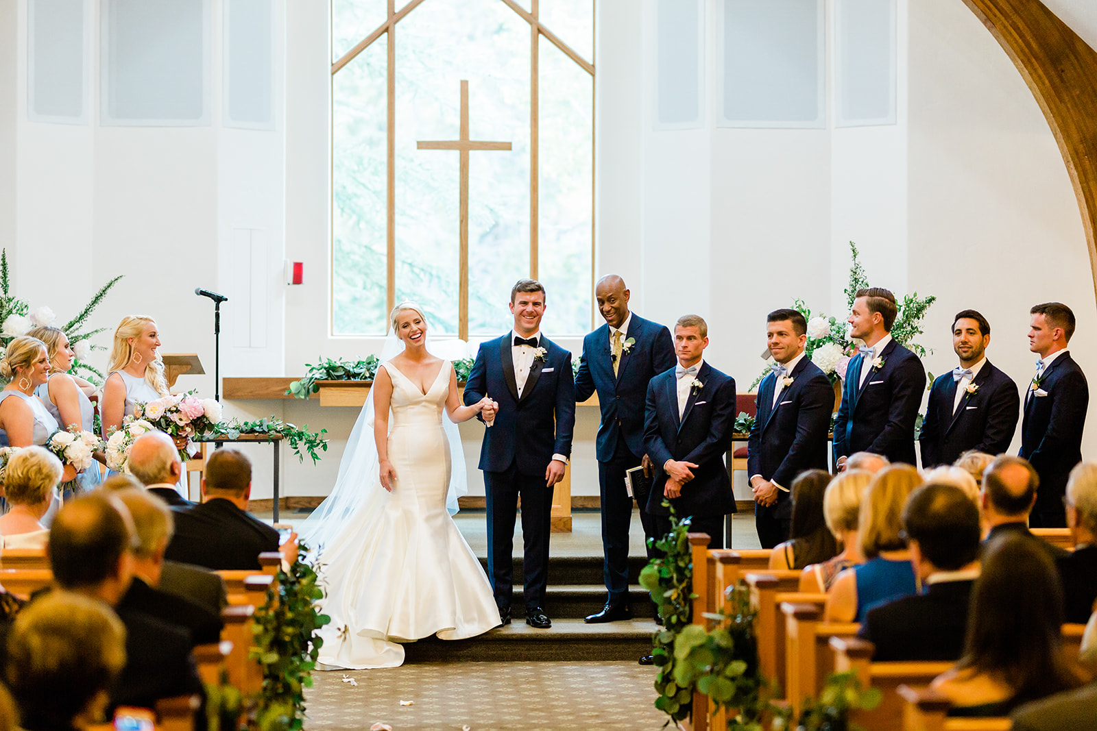 bride and groom recessional in Vail Colorado chapel