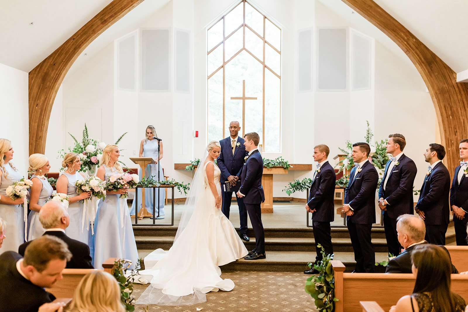 bride and groom at Vail church altar for mountain wedding