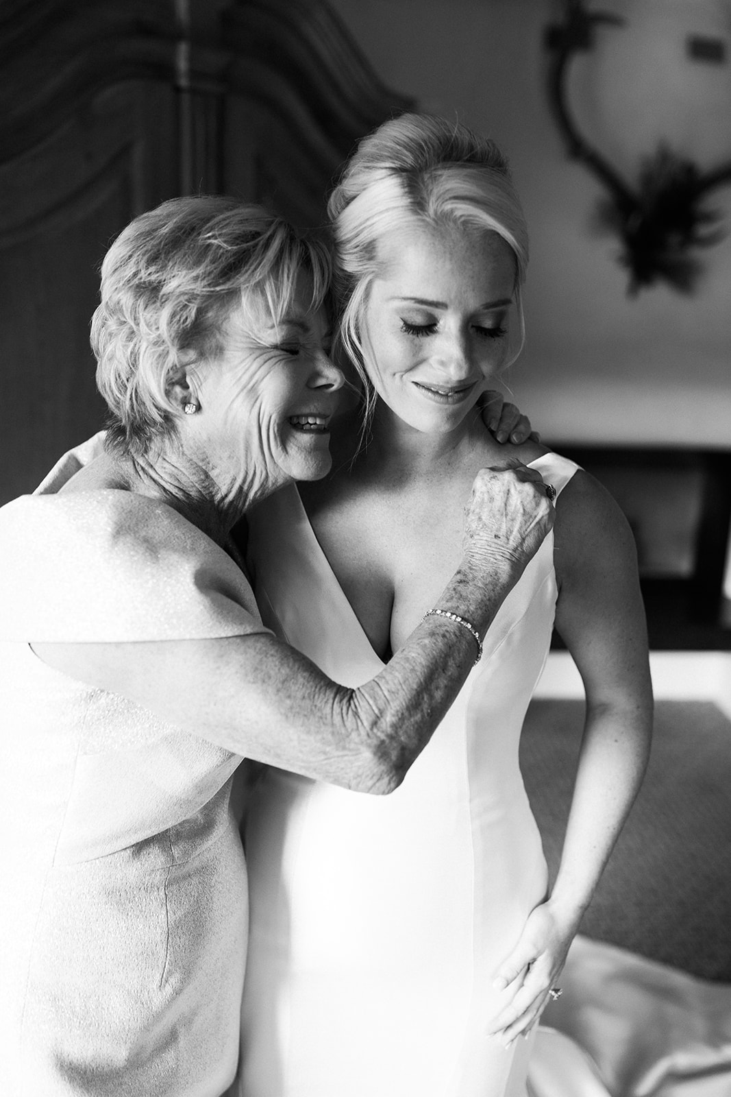 bride's grandmother hugs her after seeing her dress