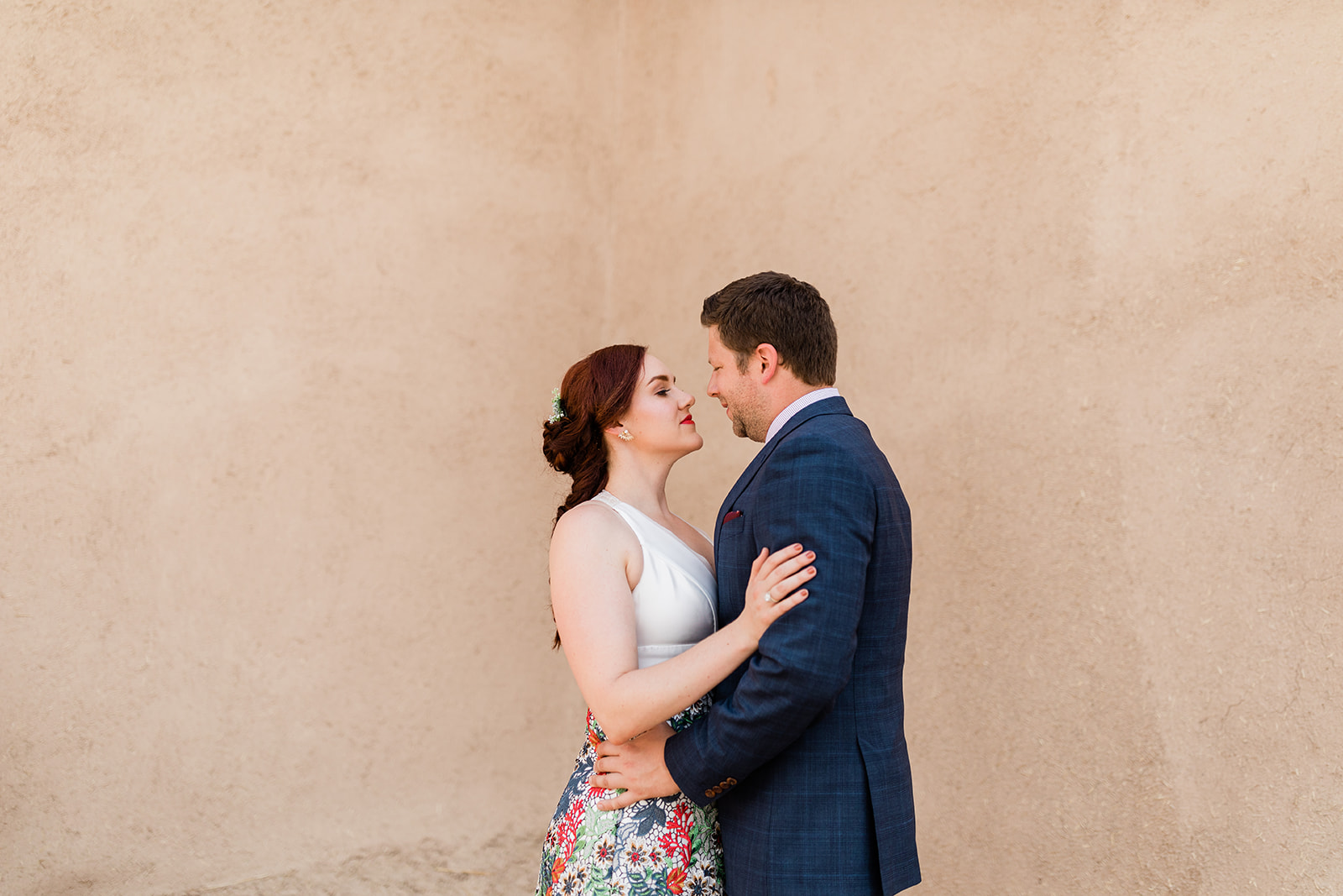 Bride and Groom portraits in front of iconic Taos New Mexico architecture