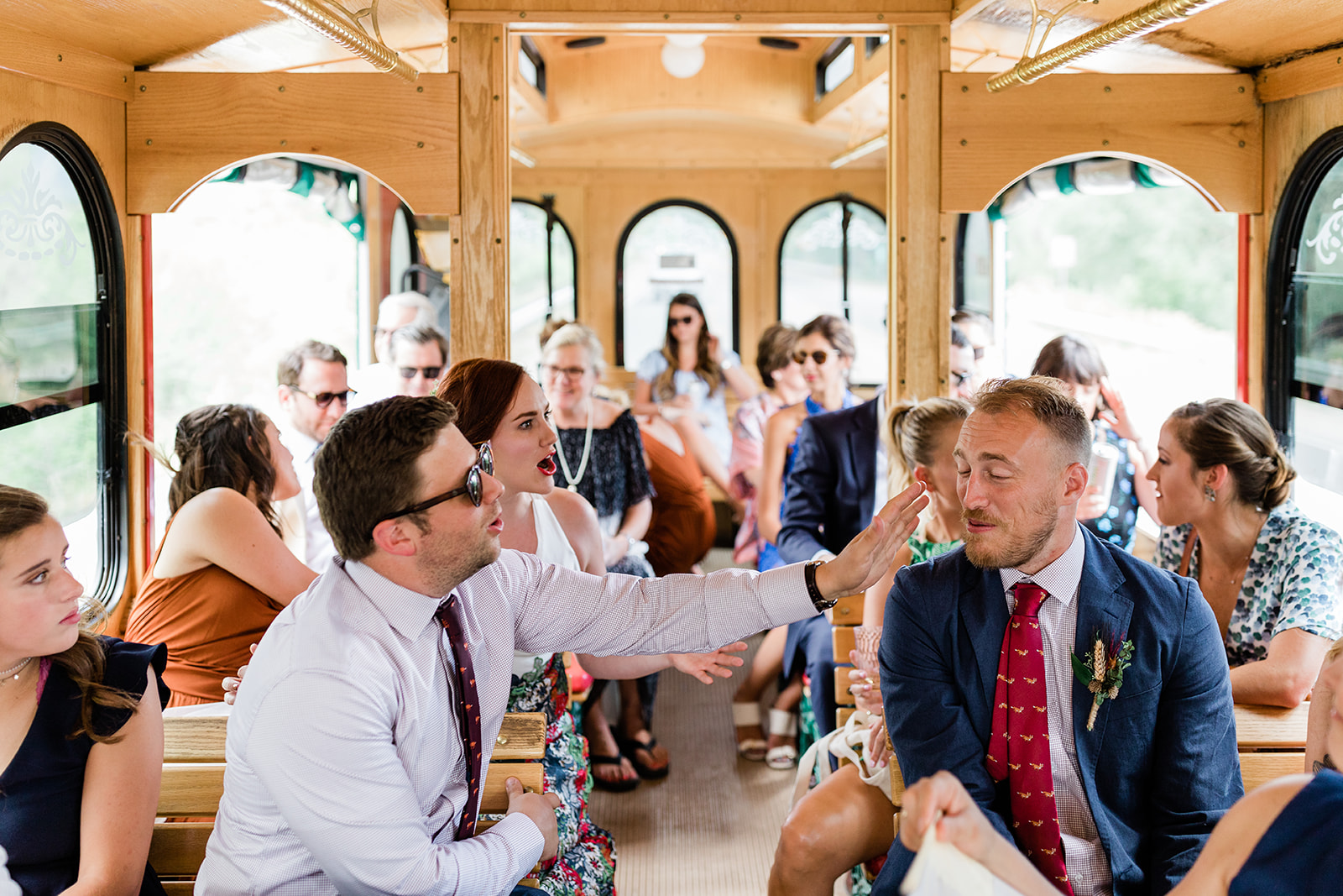 bride and groom ride to wedding on special trolley
