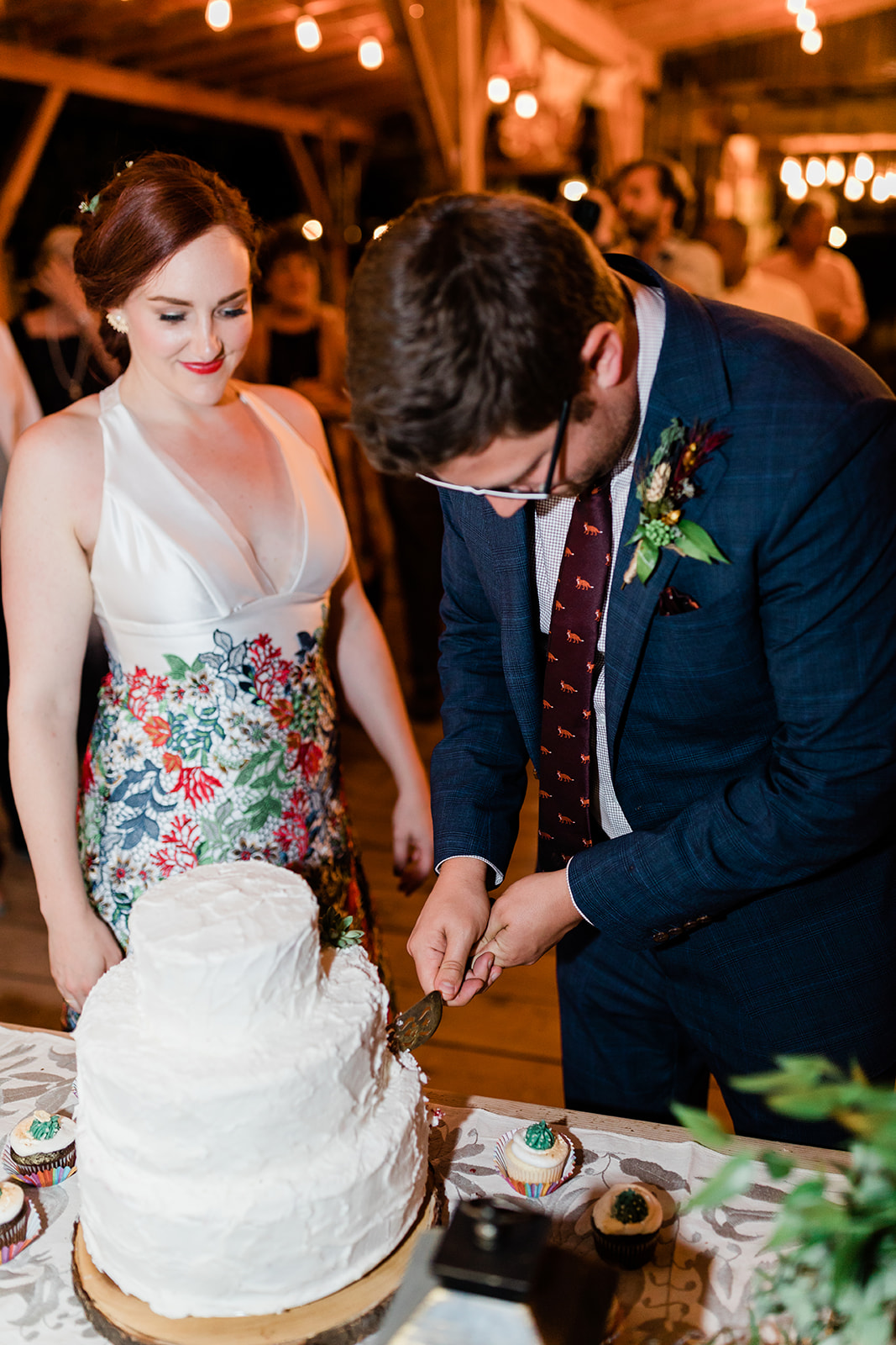 bride and groom cut southwest-themed cake