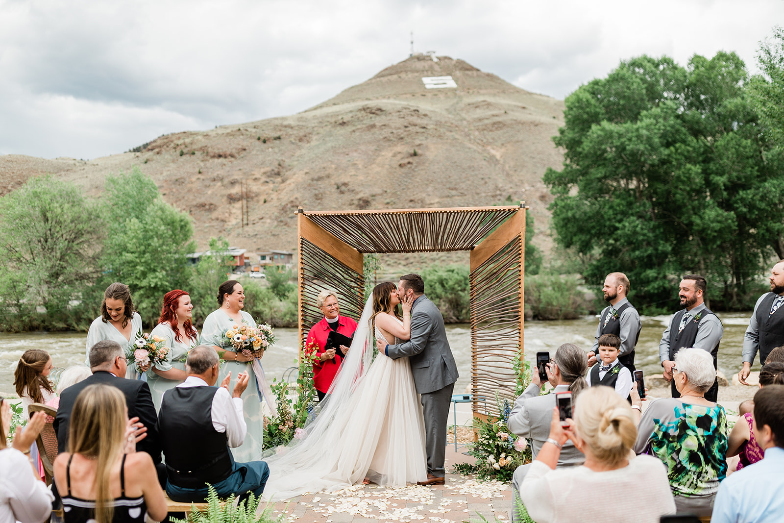 bride and groom celebrate being married at outdoor Colorado ceremony