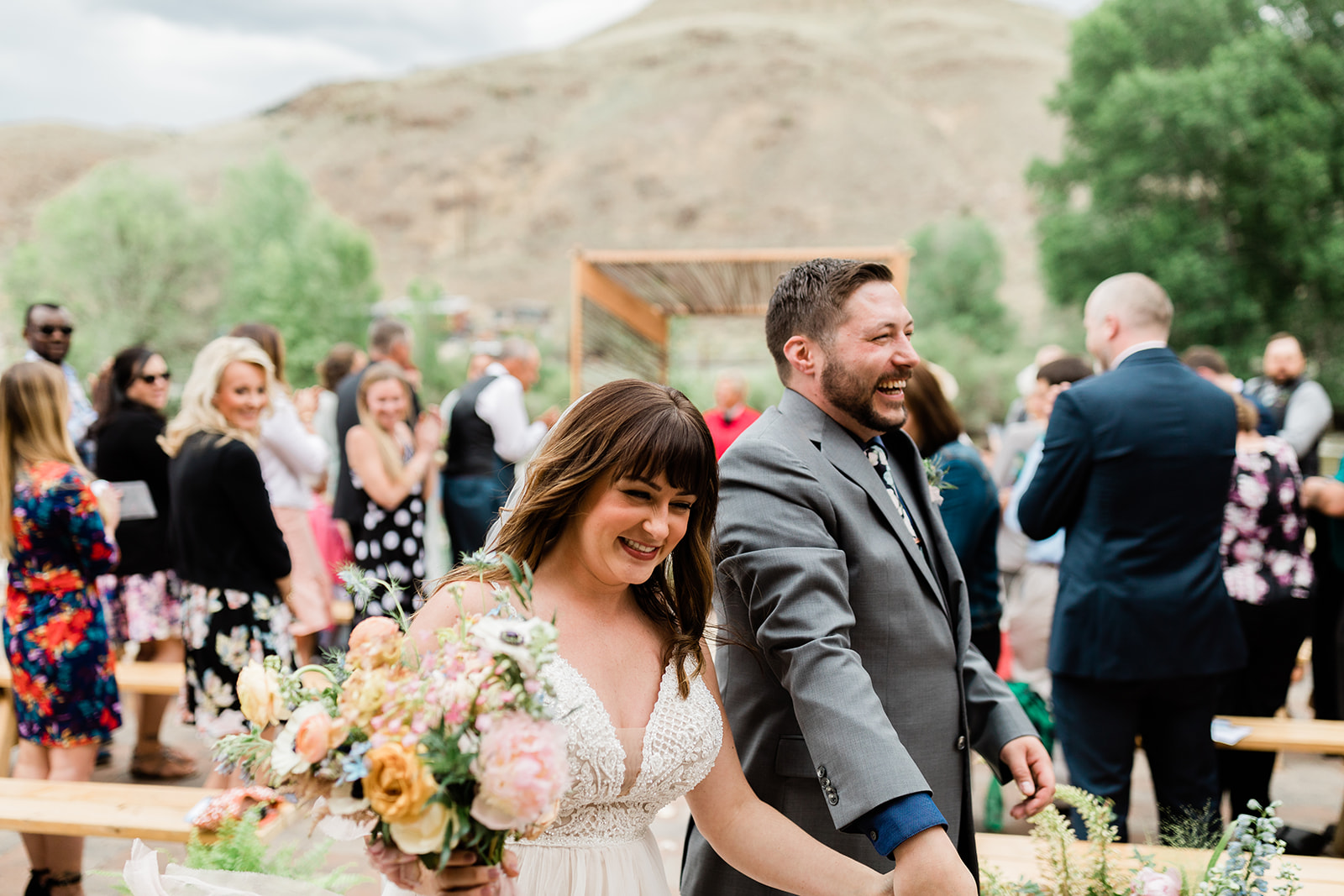 bride and groom celebrate being married at outdoor Colorado ceremony
