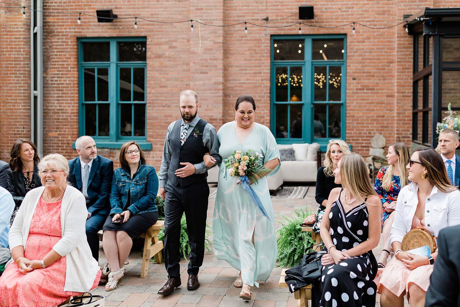 wedding party walks down the aisle for an outdoor Salida Colorado wedding 