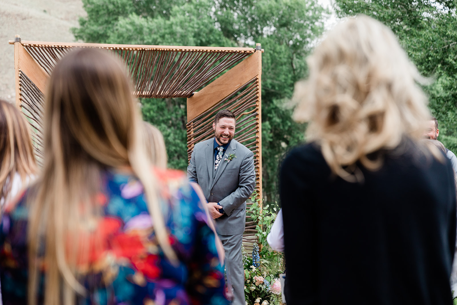 groom laughs during wedding ceremony