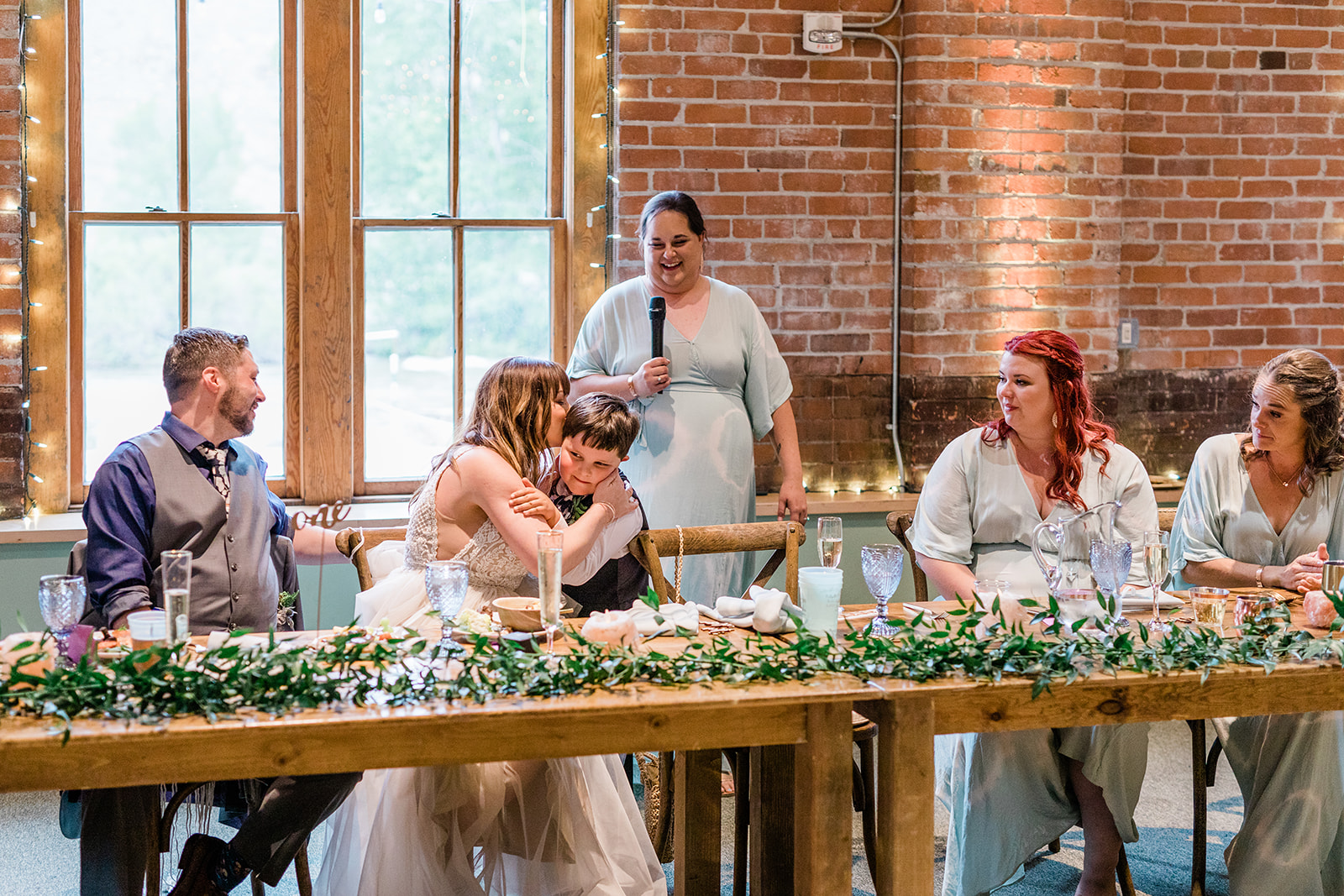 guests toast bride and groom during Salida wedding reception