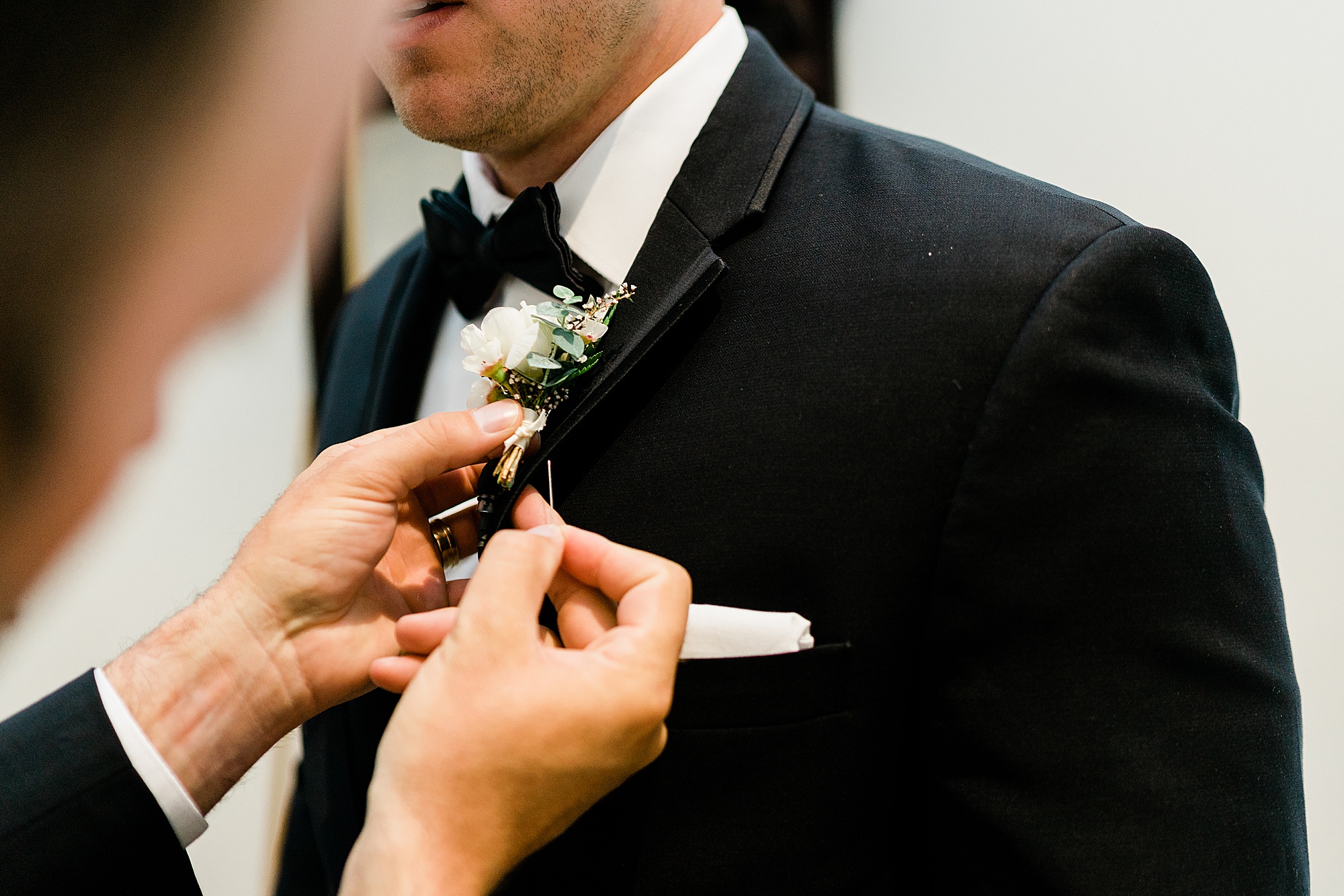 groom and boutonniere