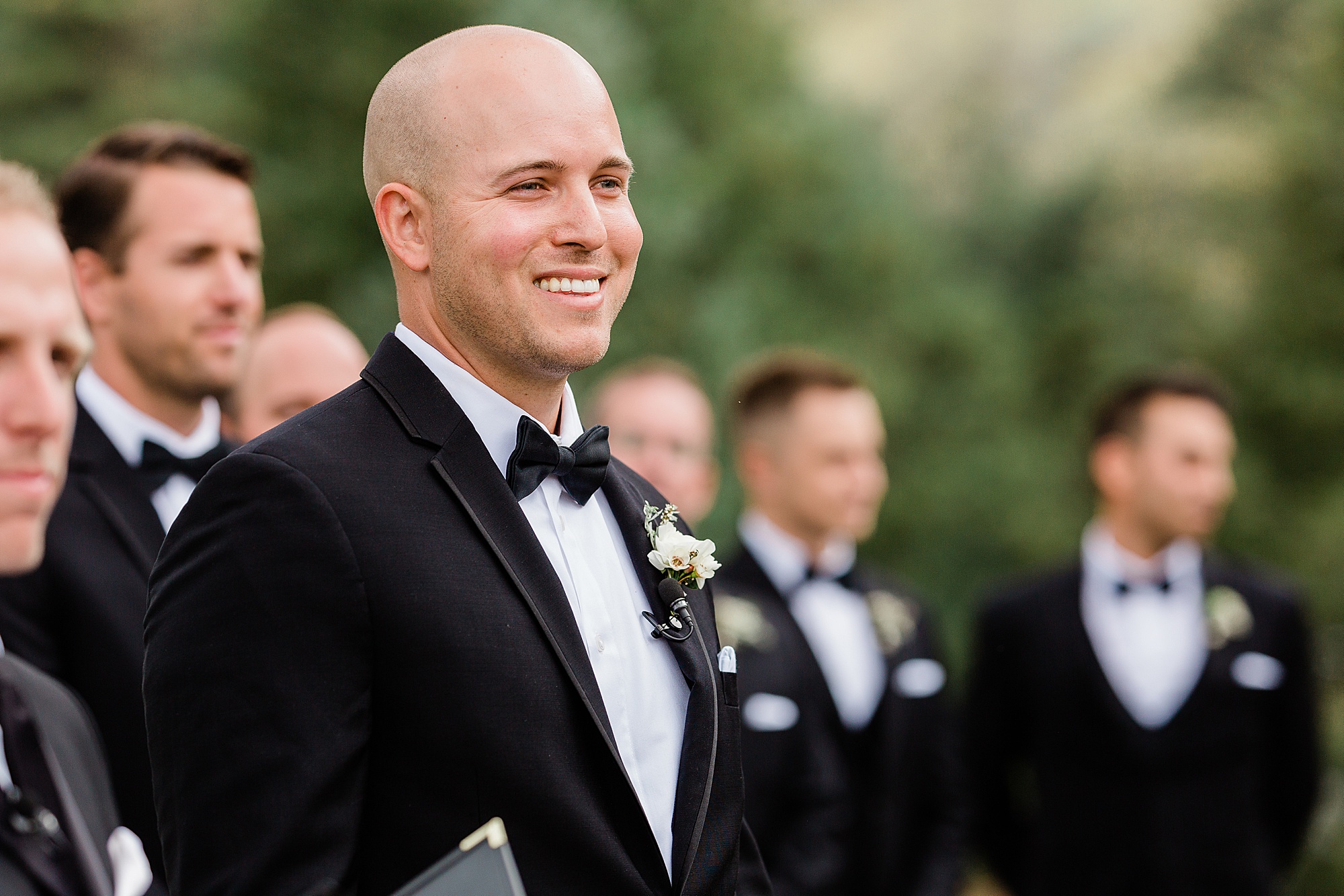 groom seeing bride for first time walking down the aisle