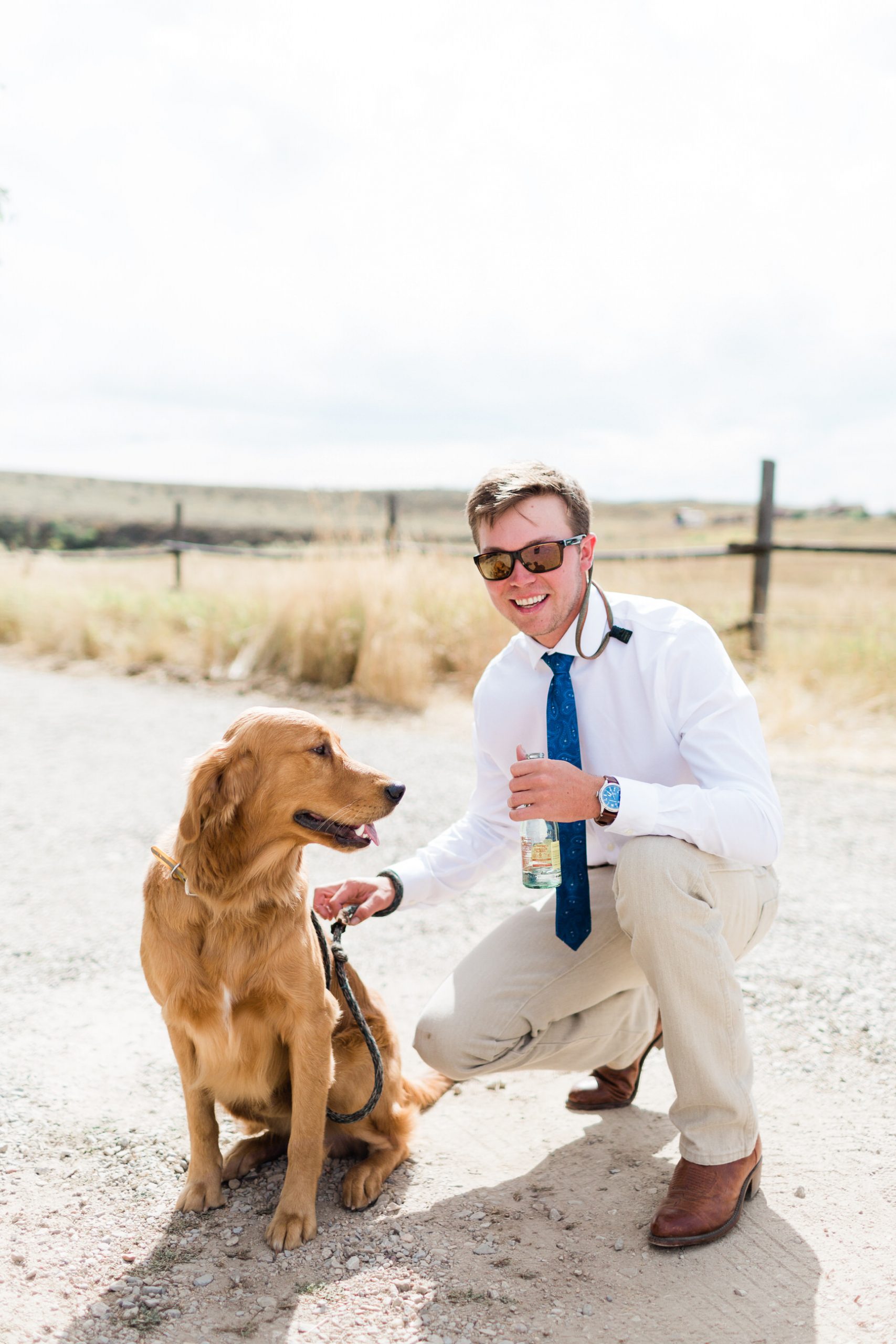 groom and dog hang out before wedding