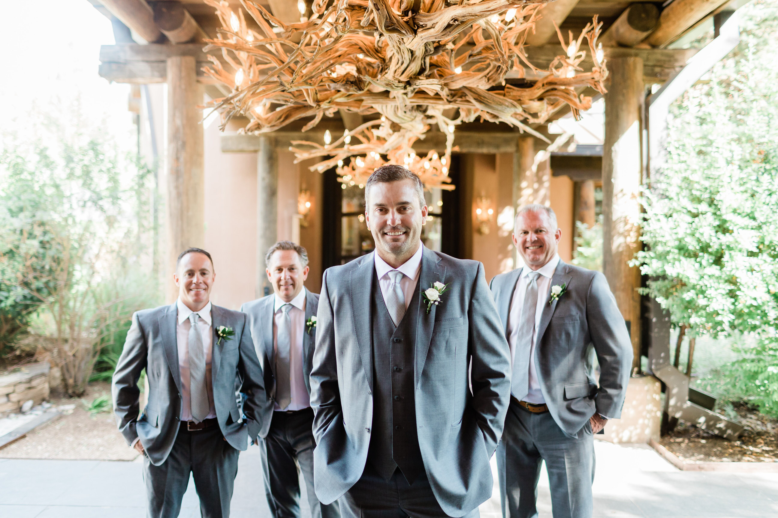 groom and groomsmen outside Taos New Mexico luxury resort wedding