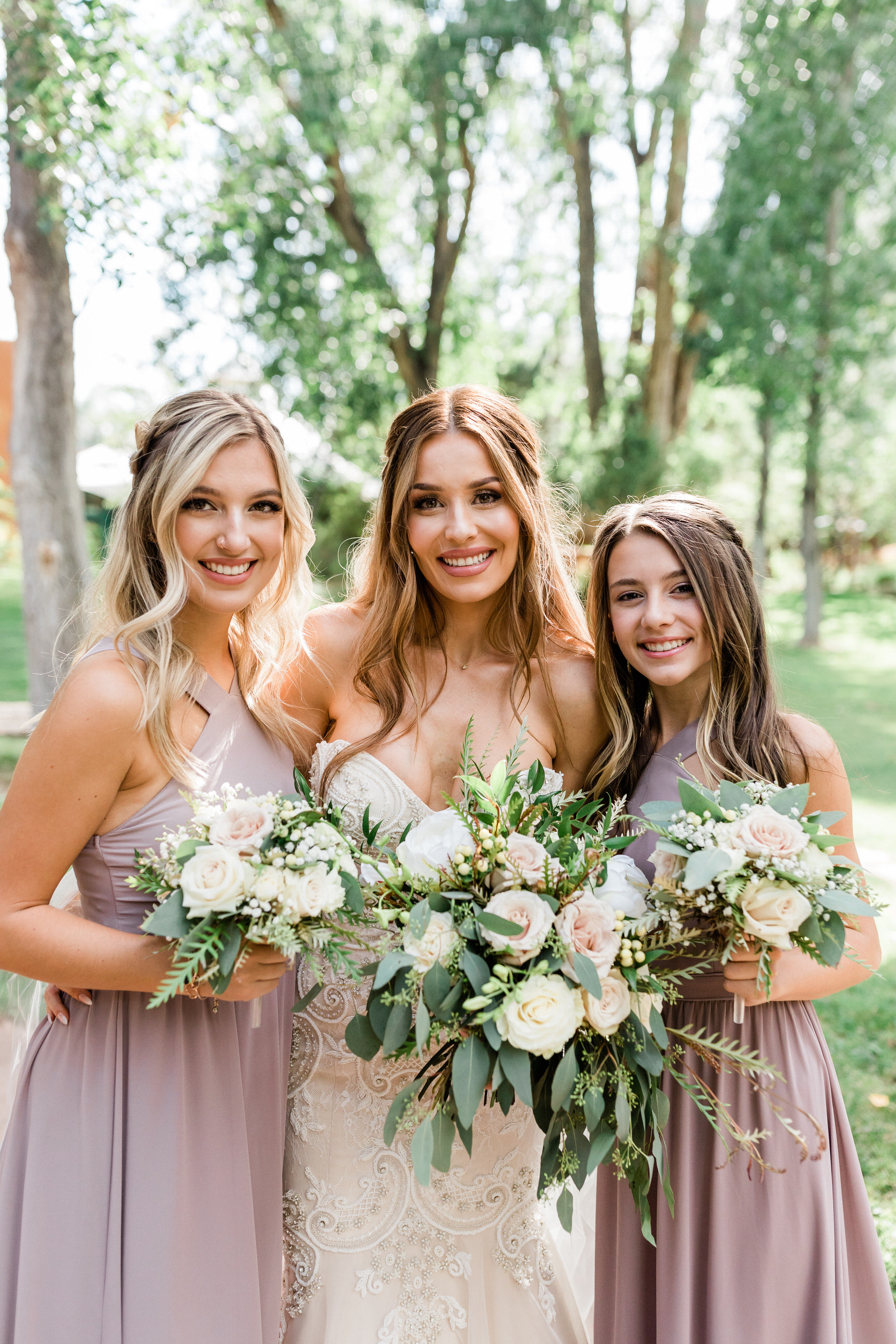bride with bridesmaids before luxury resort wedding in New Mexico