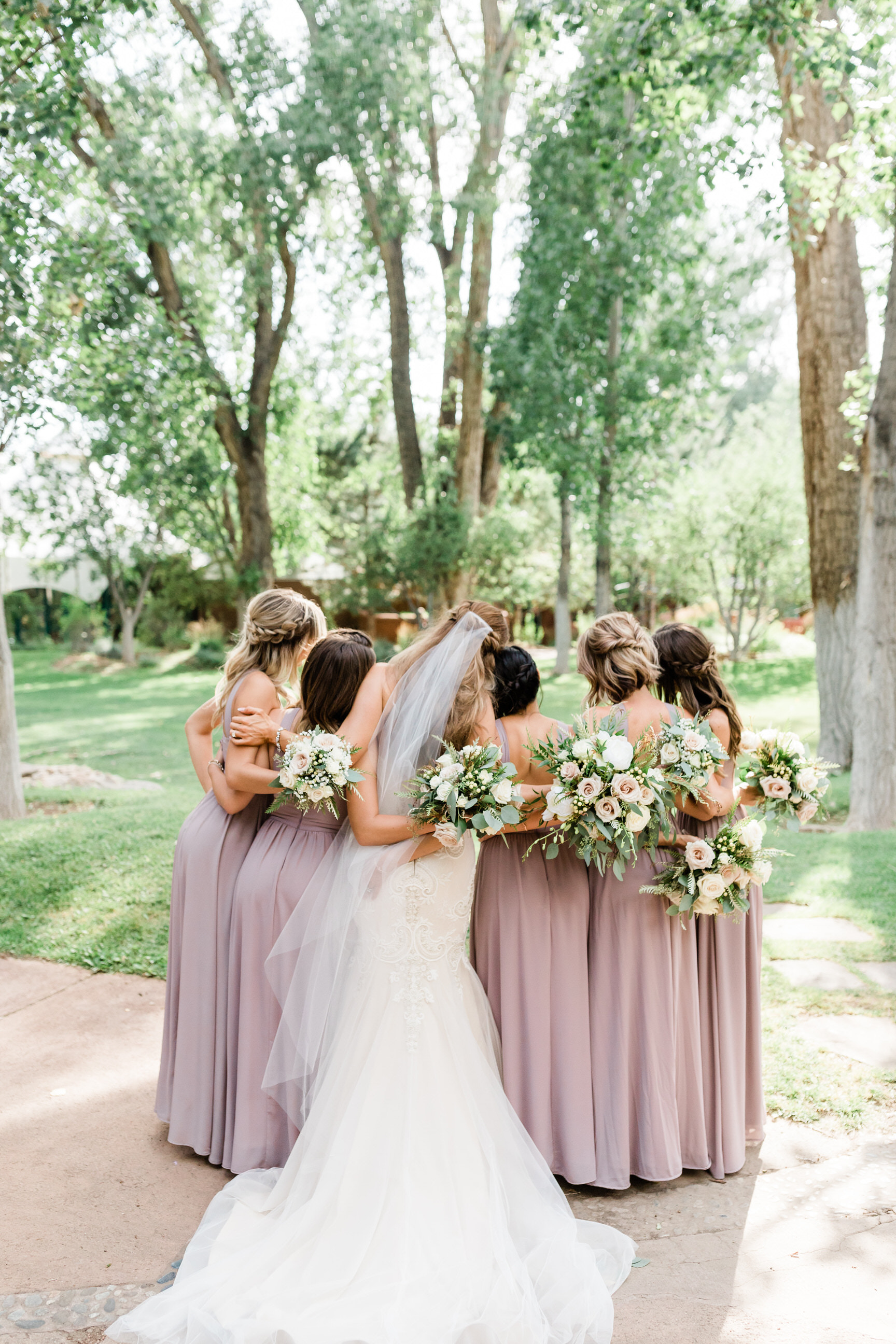 bride with bridesmaids before luxury resort wedding in New Mexico