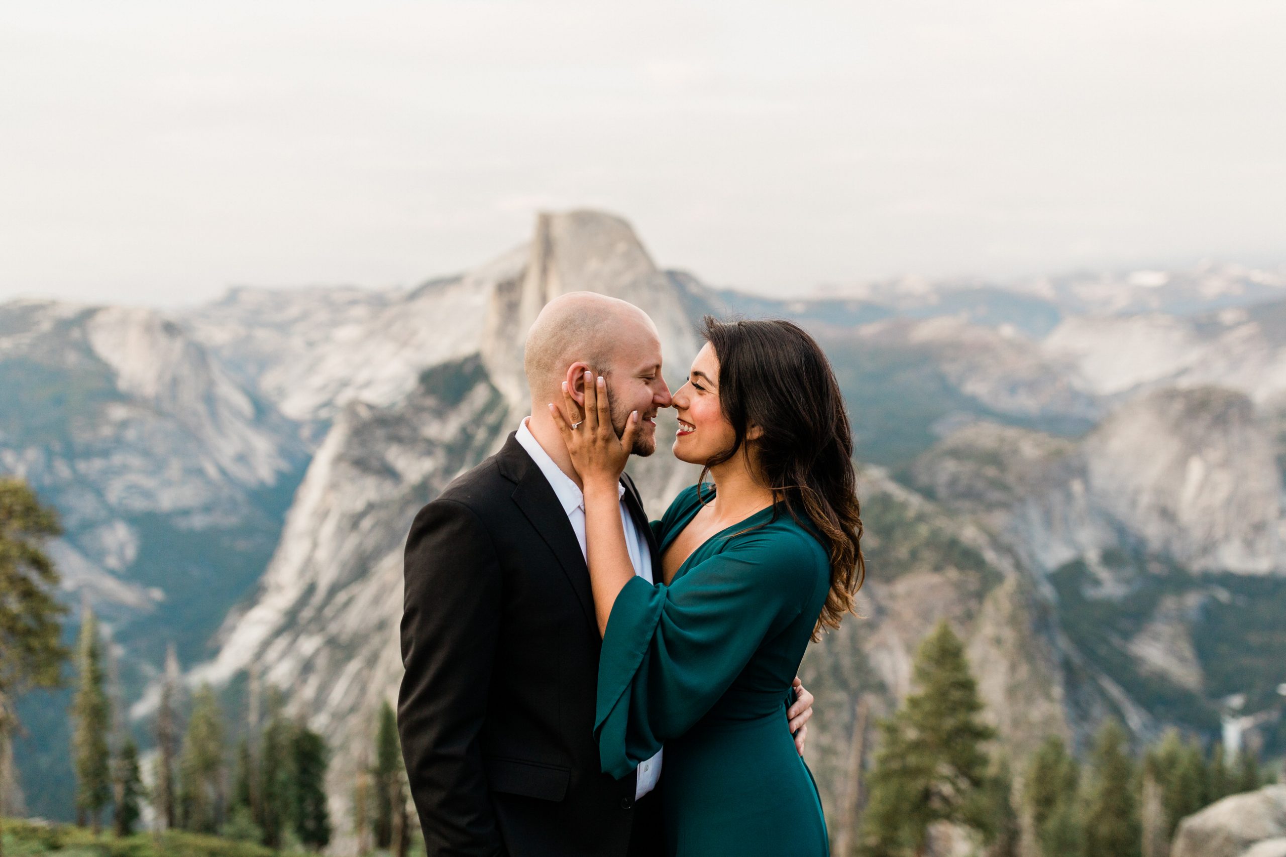 couple in front of Yosemite vista for engagement session