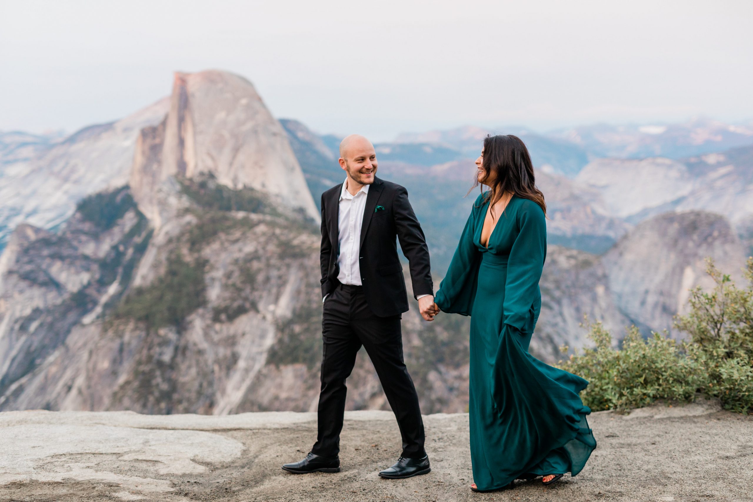 couple in front of stunning Yosemite vista