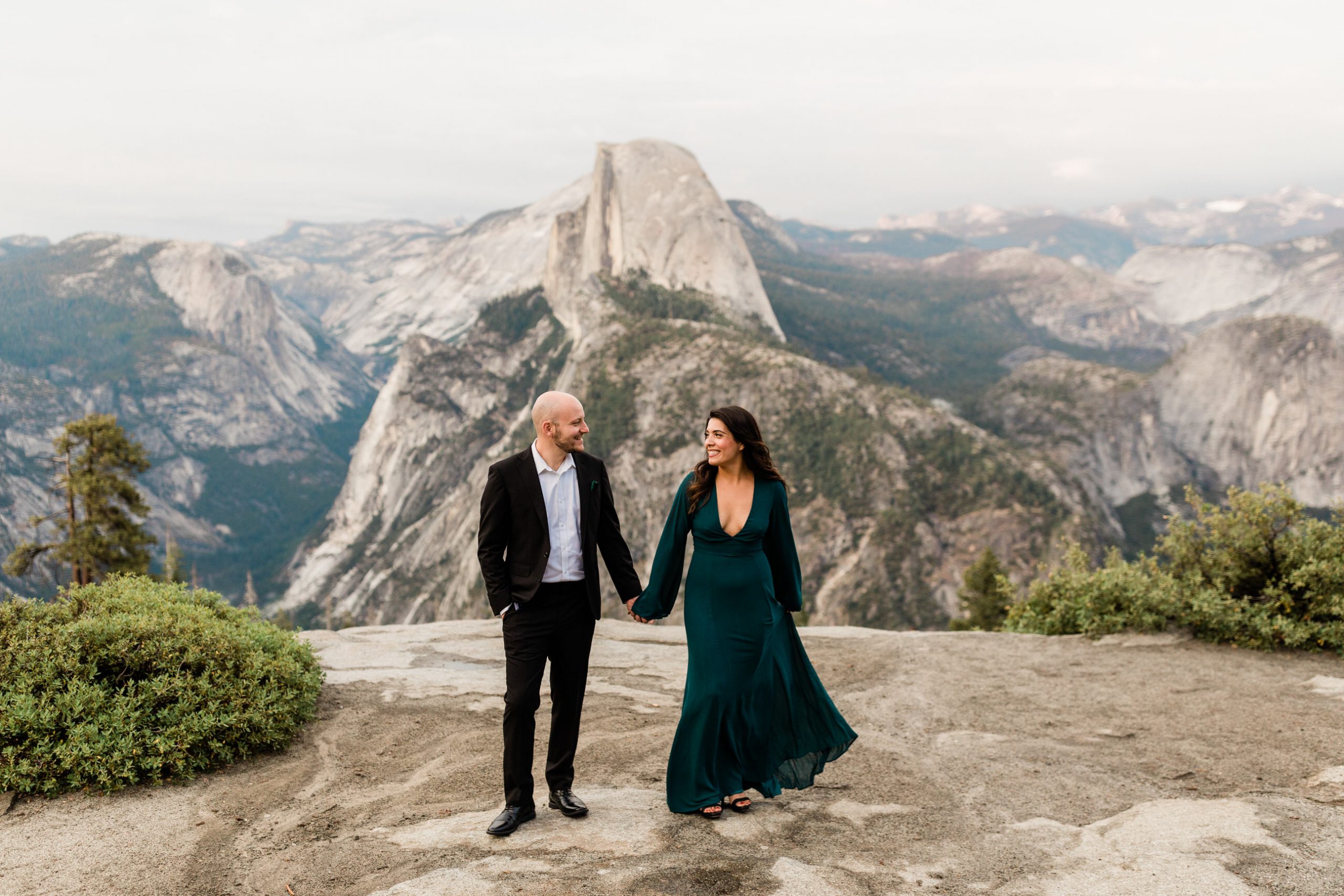 couple in front of Yosemite vista for engagement session