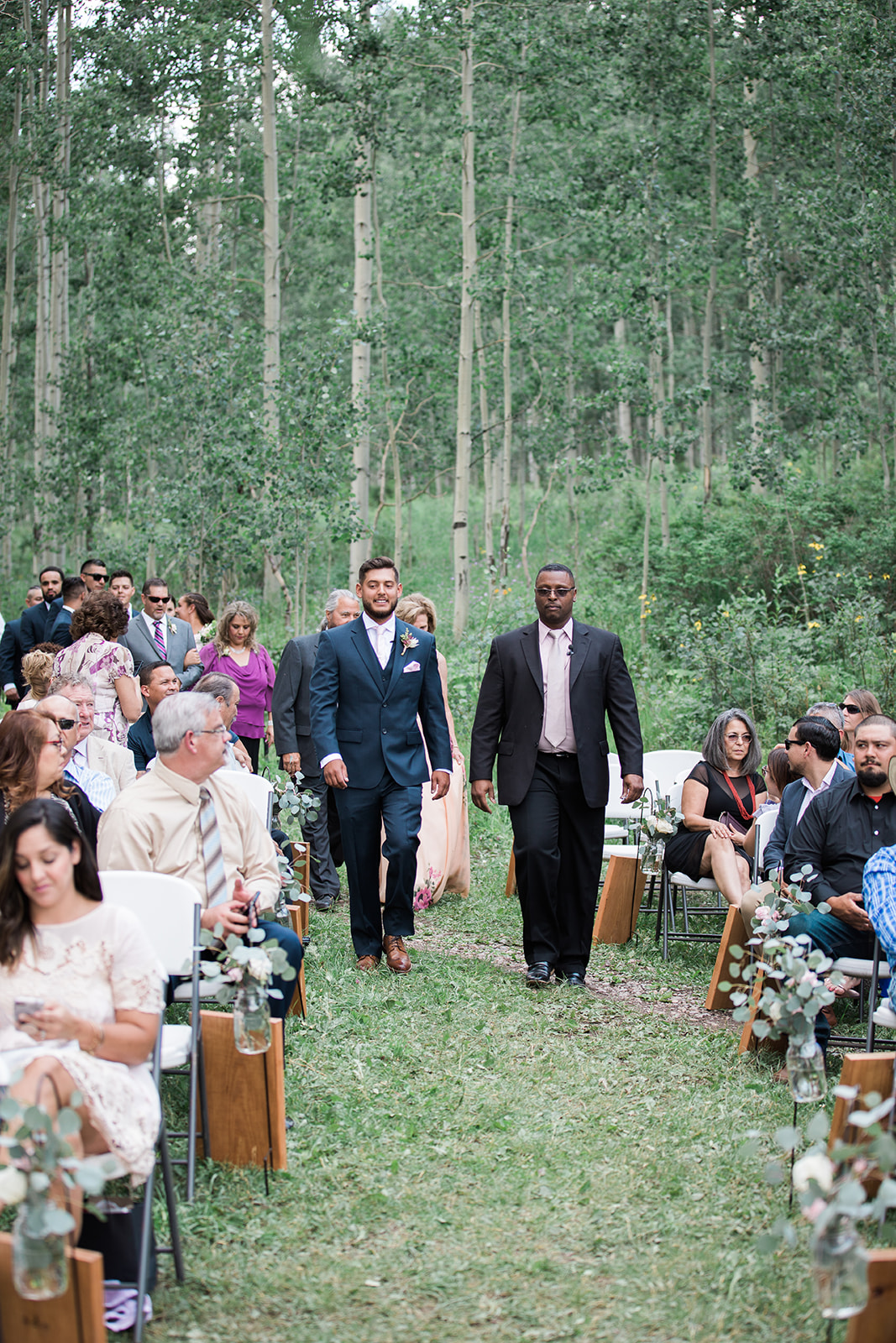 groom walks down the aisle in Durango outdoor wed