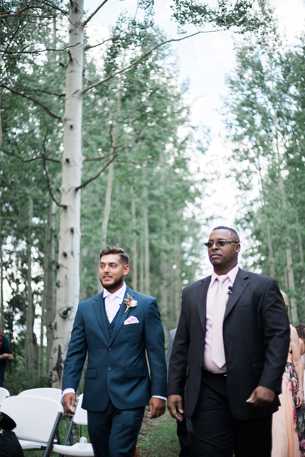 groom waits for bride to come down aisle at Silverpick Lodge wedding ceremony