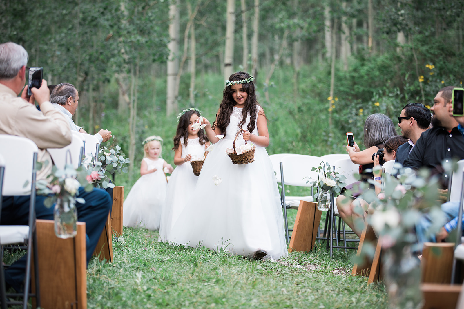 flower girls in white dresses at outdoor Durango wedding