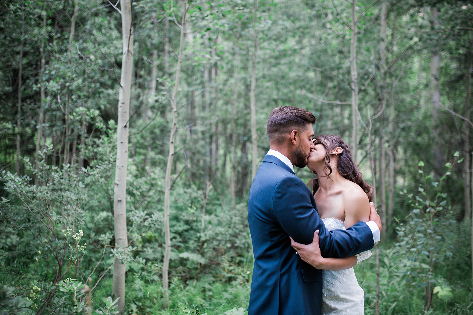 bride and groom standing in woods Silverpick Lodge