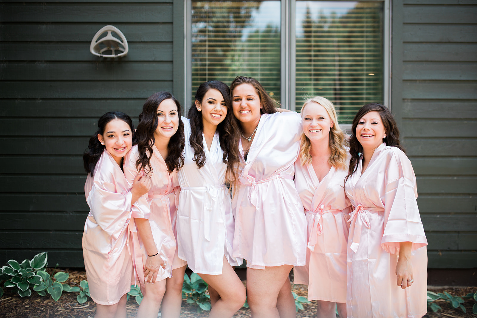 bride and bridesmaids in robes at Silverpick Lodge Durango wedding