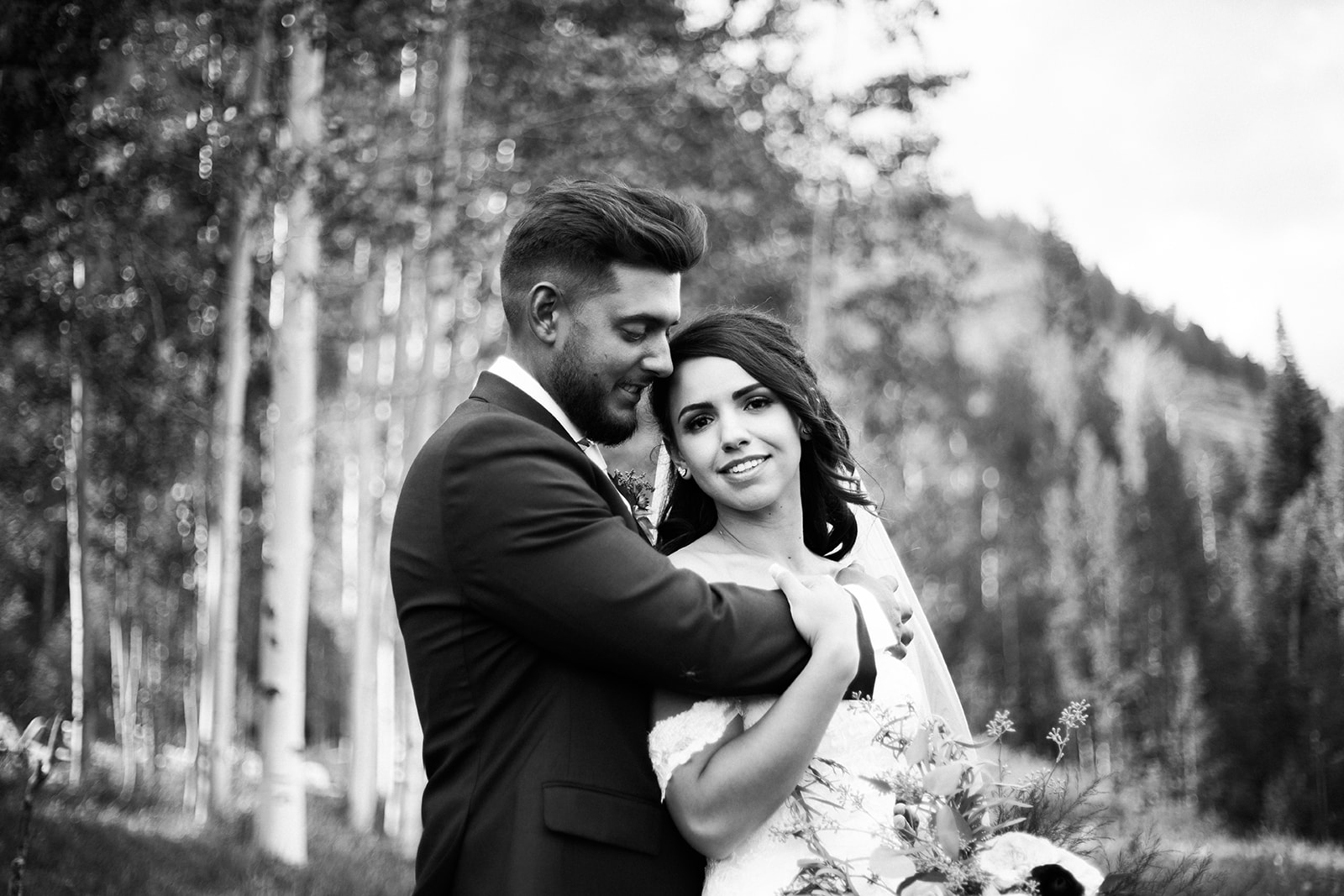 bride and groom in Colorado mountain field