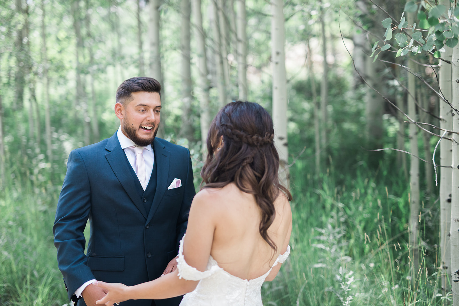 Silverpick Lodge groom looks at bride for first time in Colorado woods