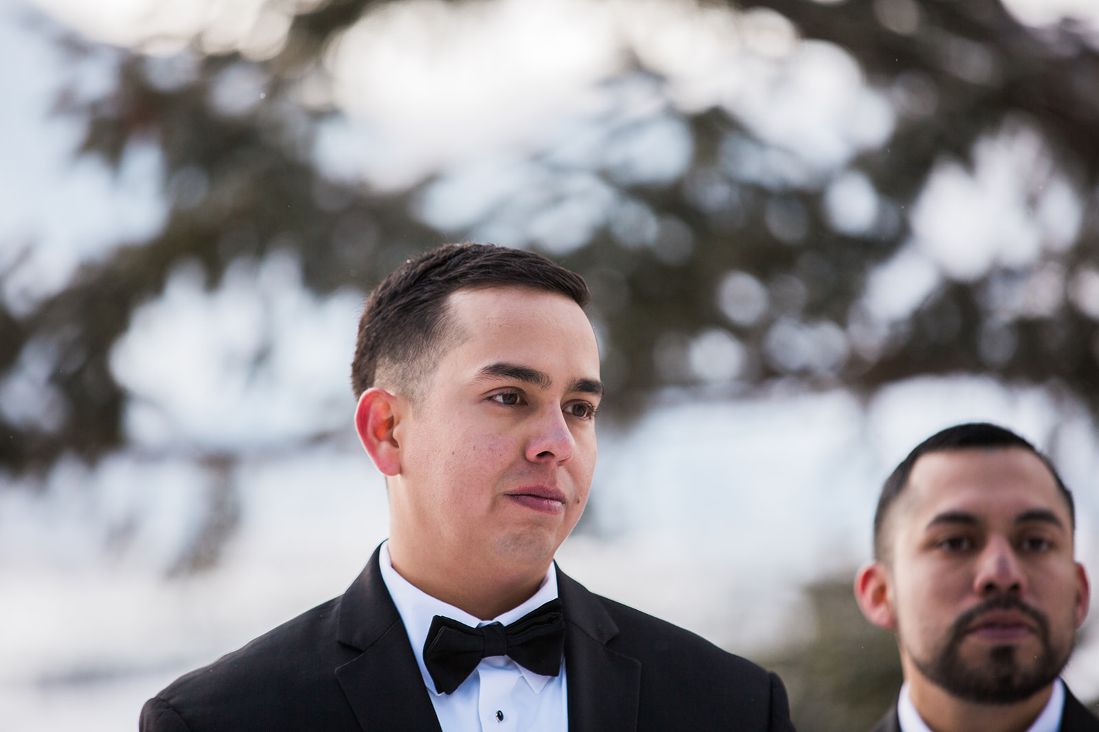 groom watches for bride at elopement ceremony