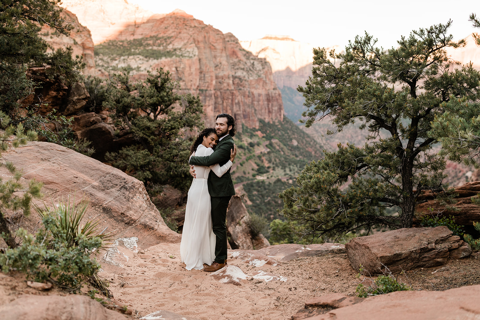 couple dances in front of romantic Utah dessert backdrop