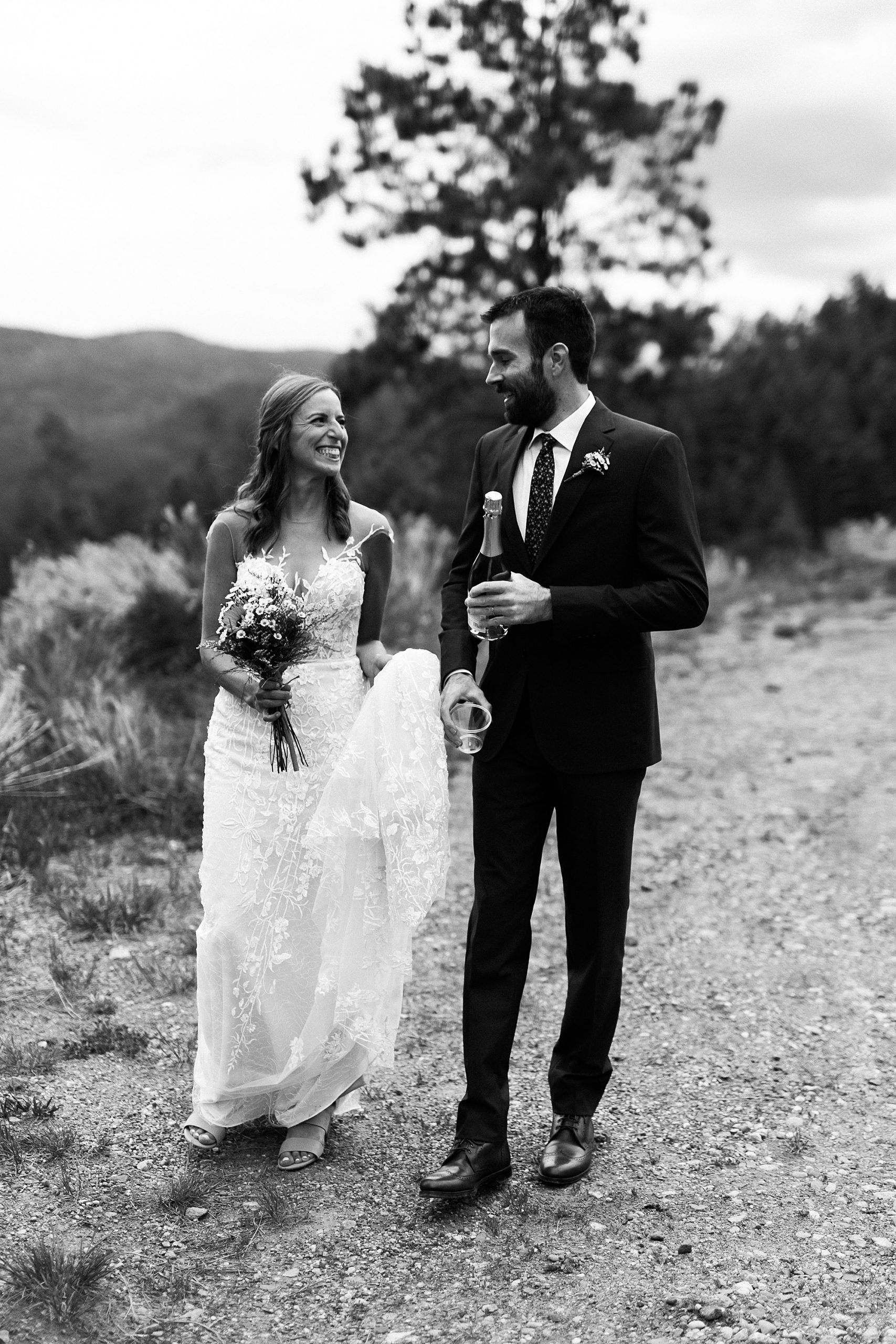 bride and groom walking in taos new mexico
