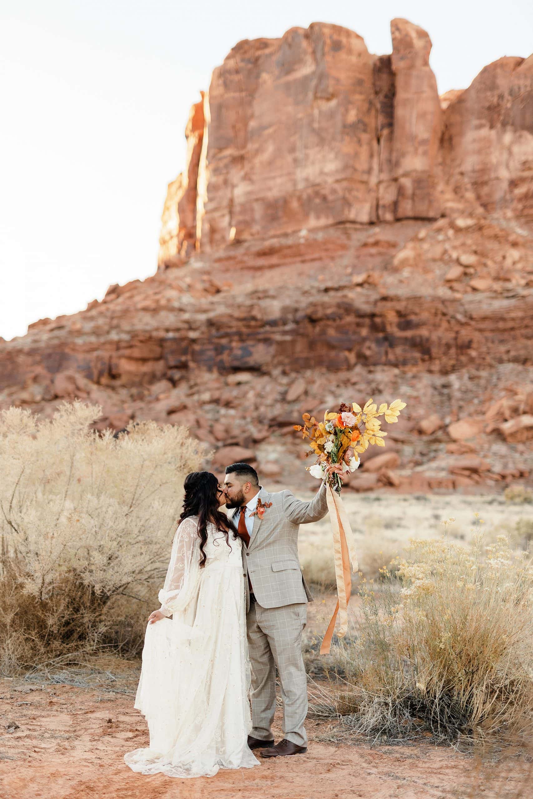 A couple celebrates their elopement in Moab.