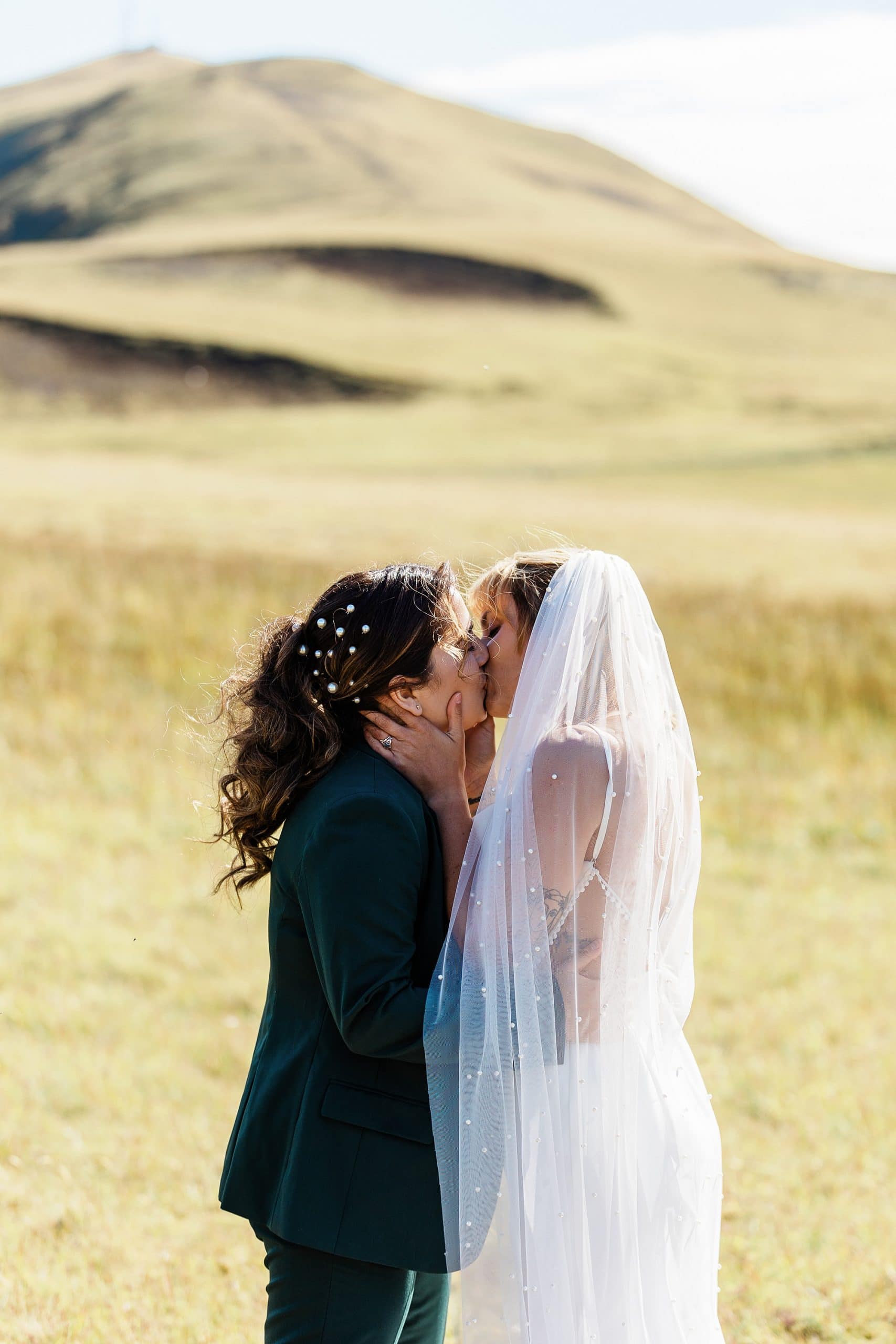 A couple shares a kiss in the Icelandic Highlands after they elope