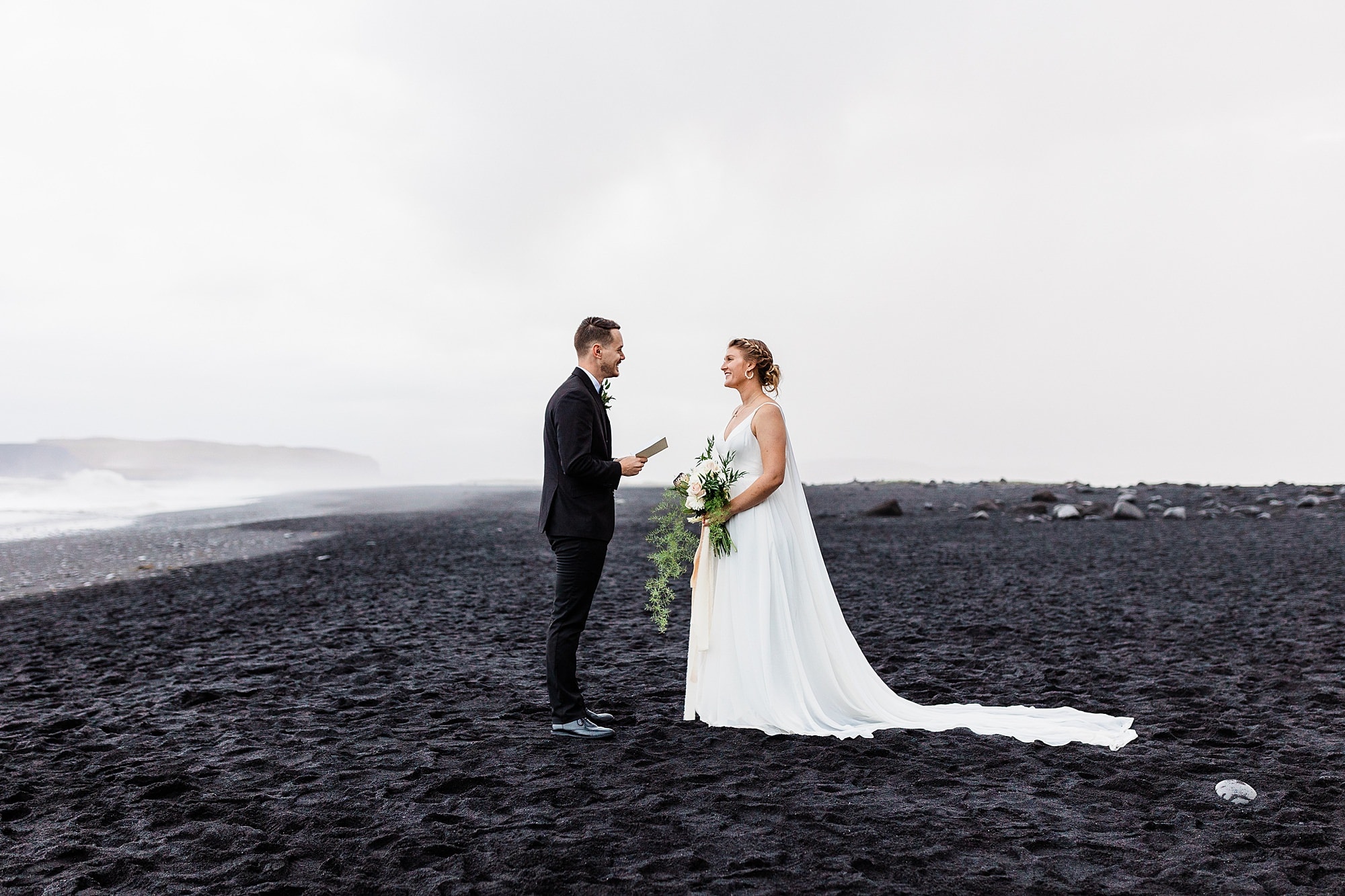 A couple says their vow son Black Sand Beach as they elope in Iceland