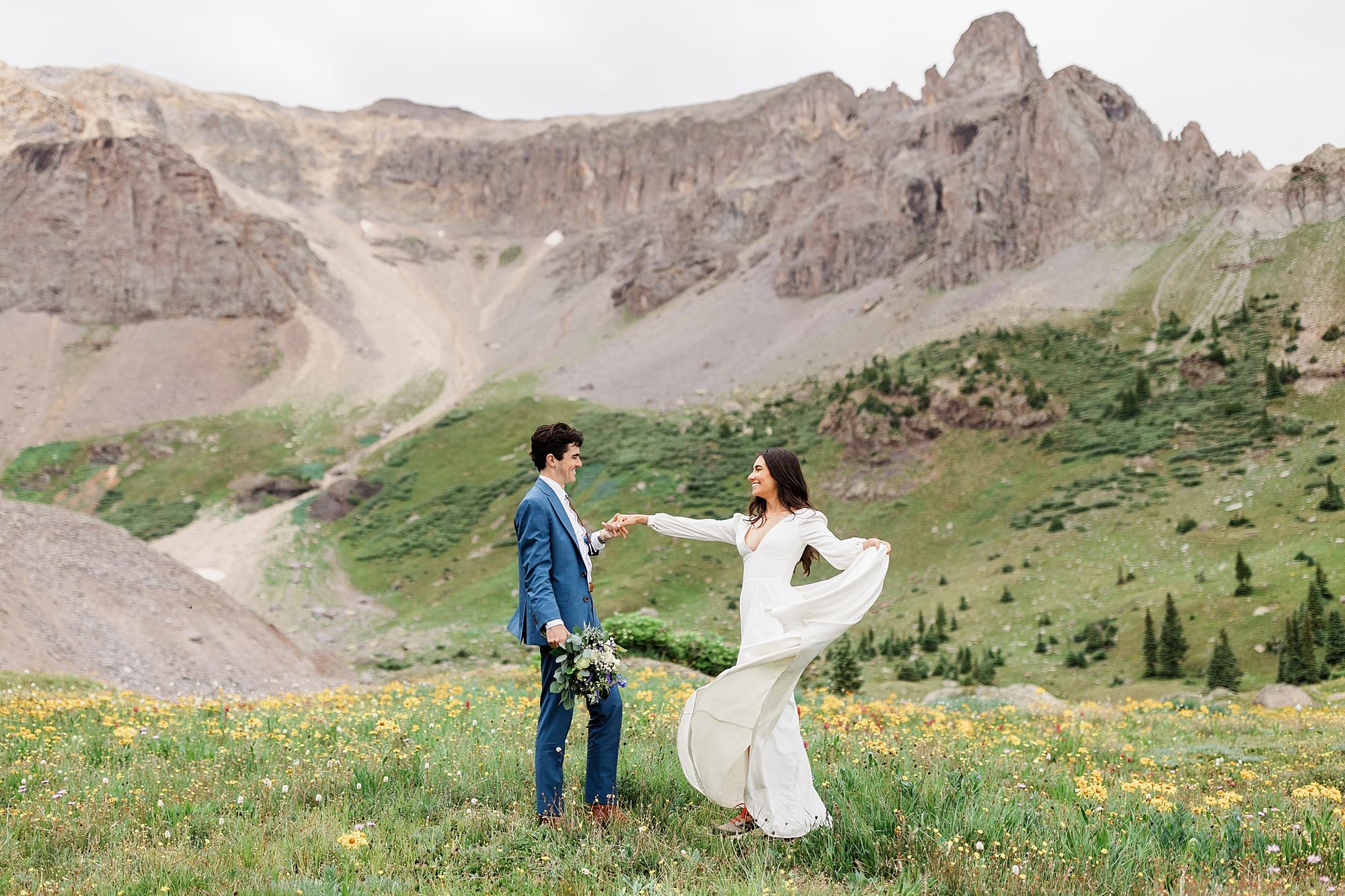 A couple dances in a field of wildflowers in Colordo