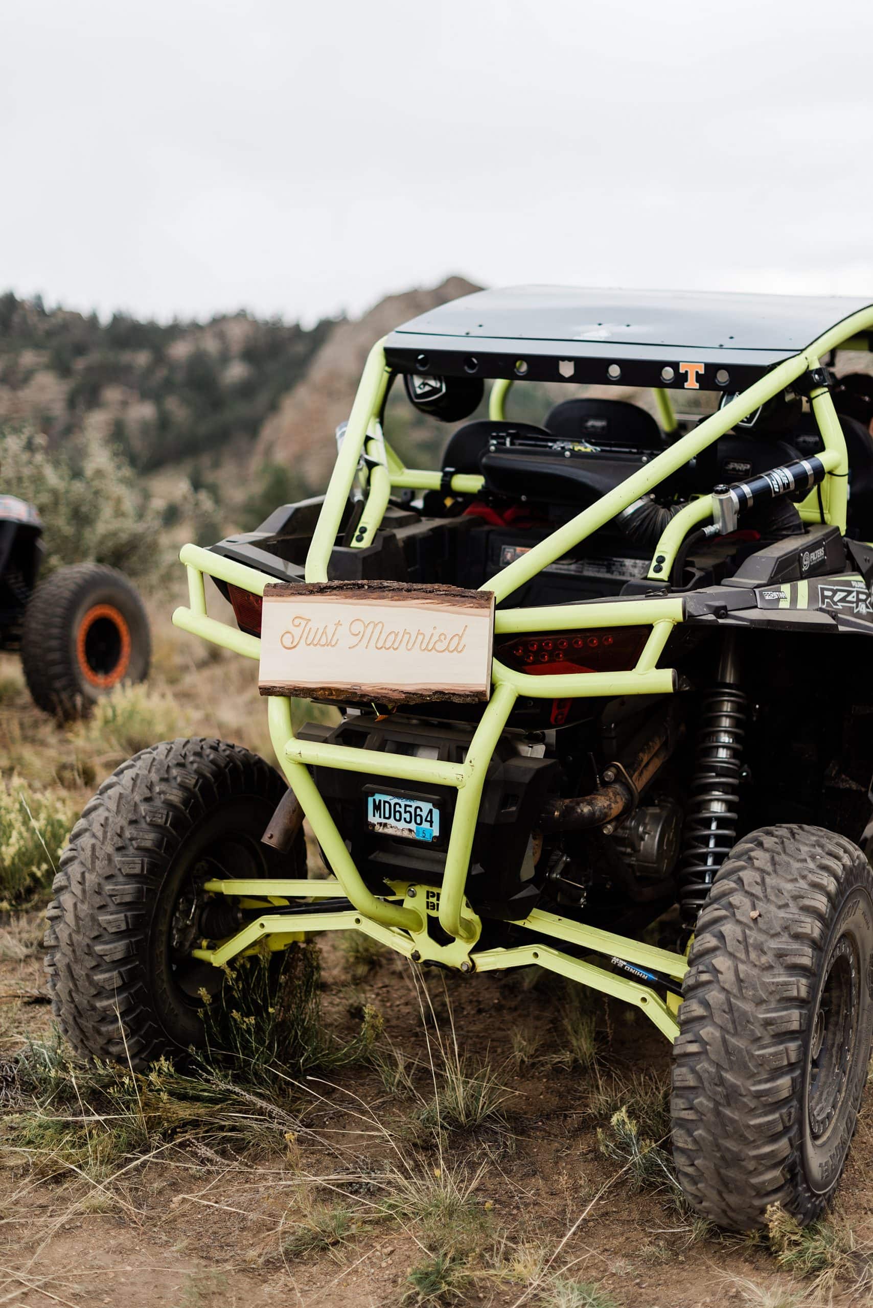 An off-roading vehicle has a wooden sign on the back that says "just married" at Fourmile in Buena Vista, Colorado. 