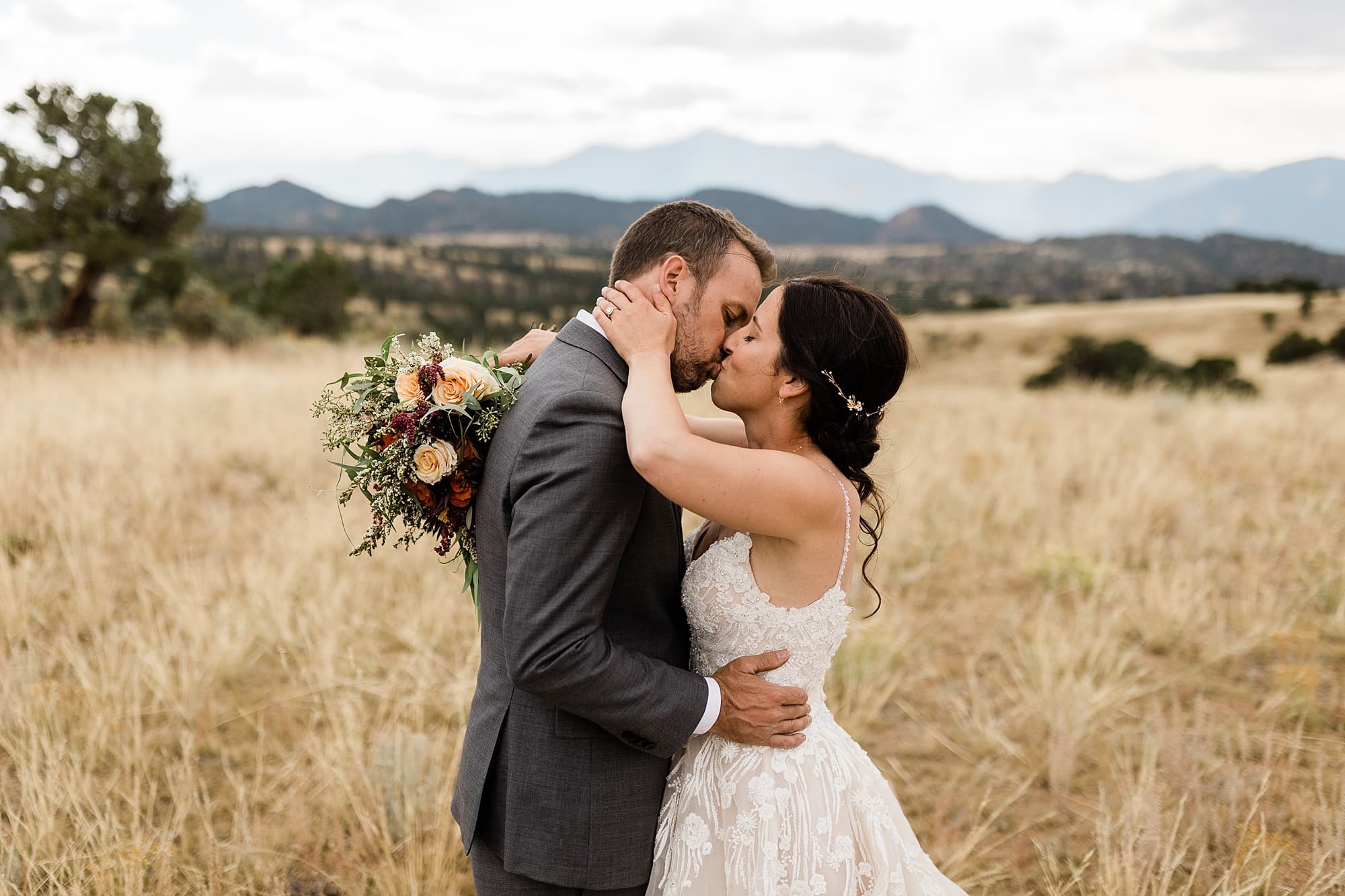 A couple kisses after their intimate wedding in Buena Vista, Colorado