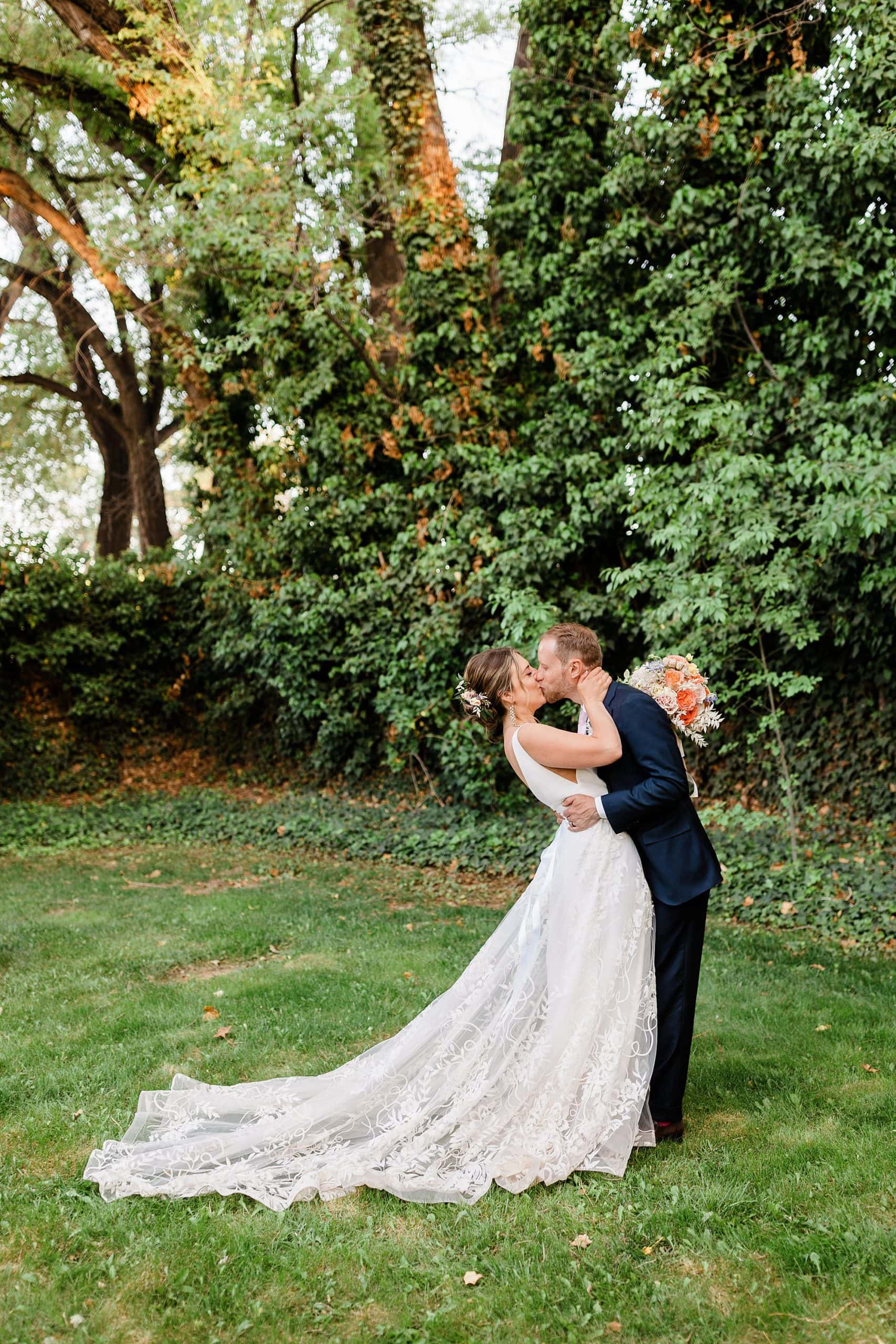 A couple kisses in a garden in New Mexico during their elopement