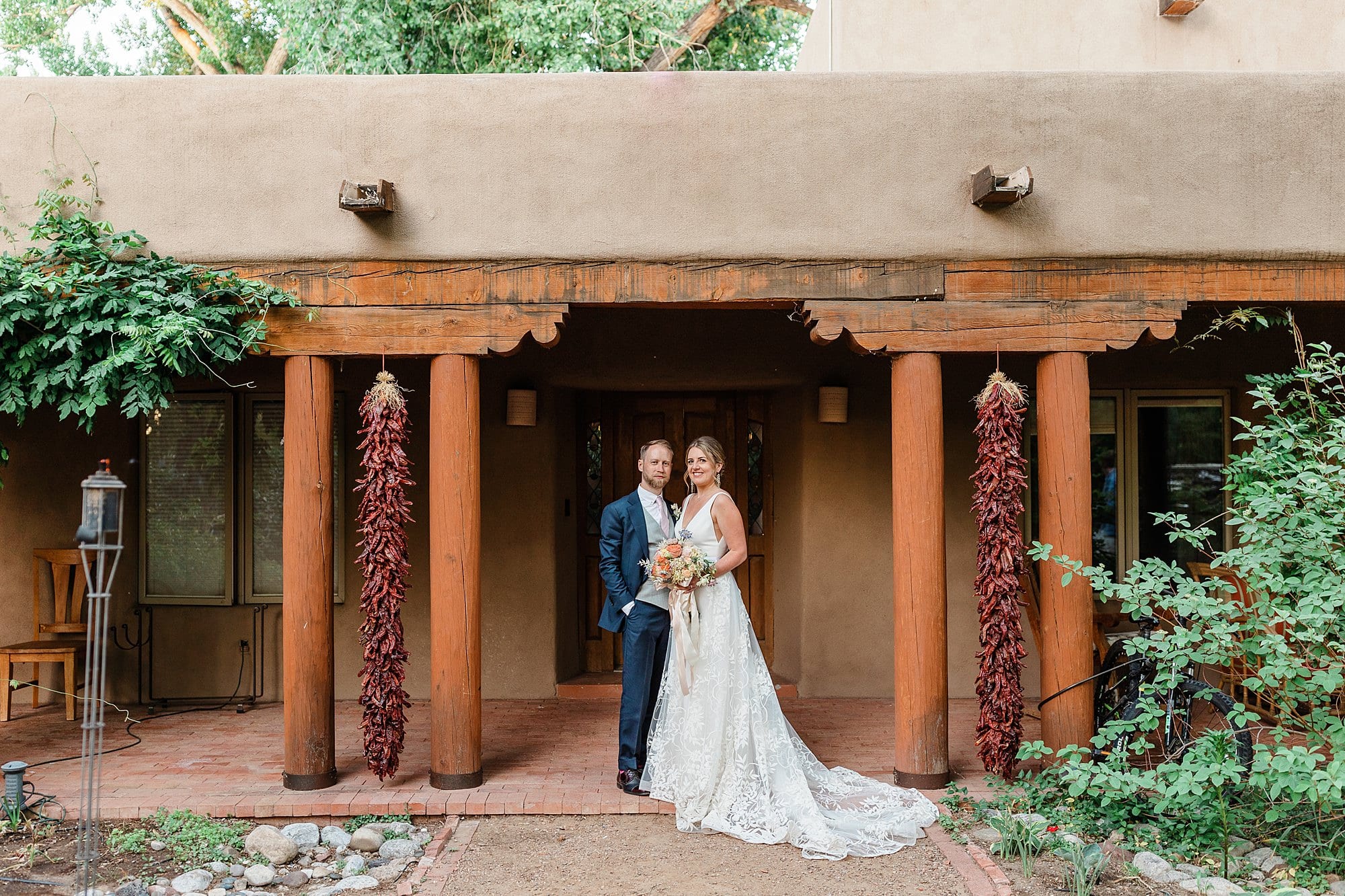 A couple poses in wedding attire in New Mexico