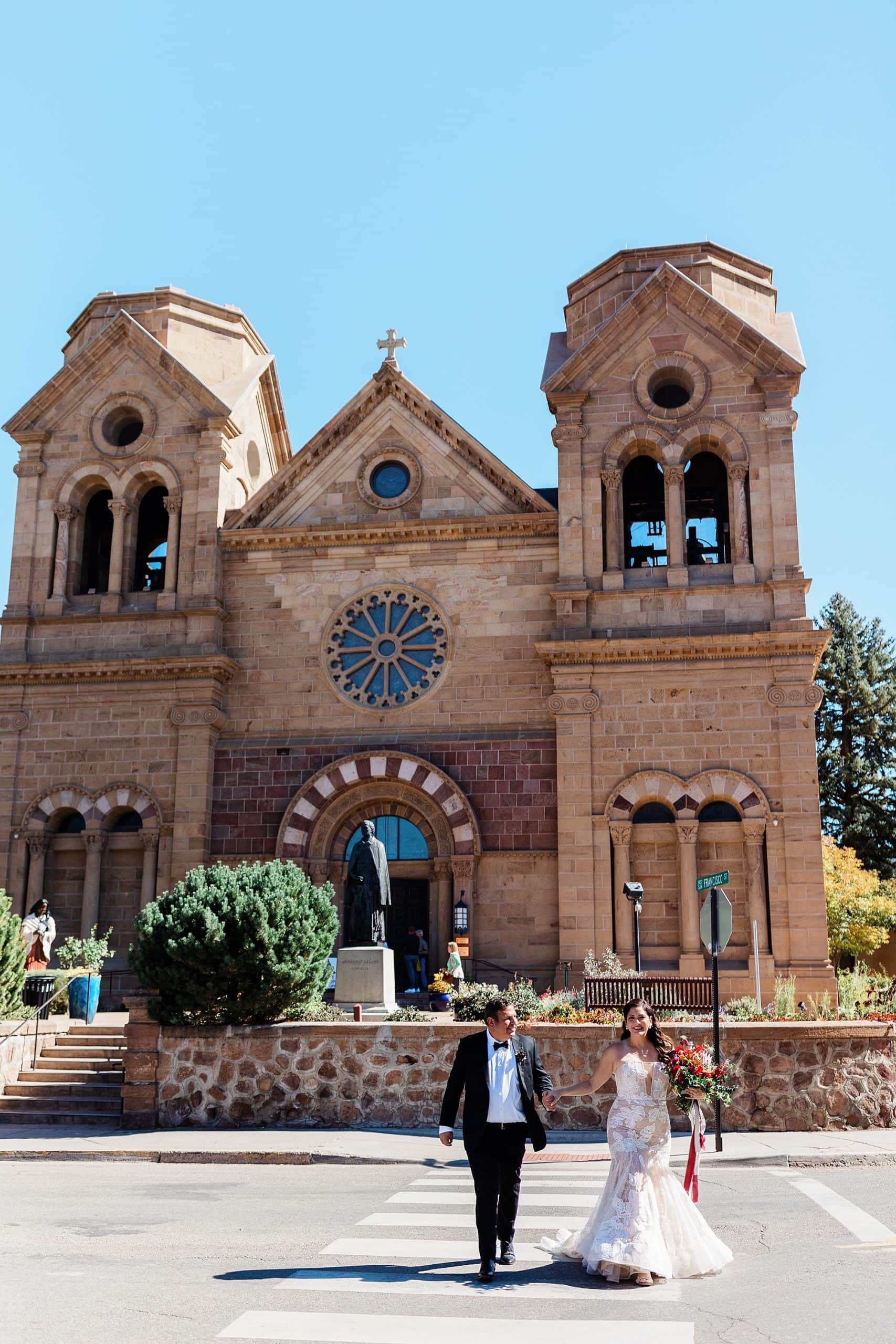 A couple celebrates their elopement in front of a church in New Mexico