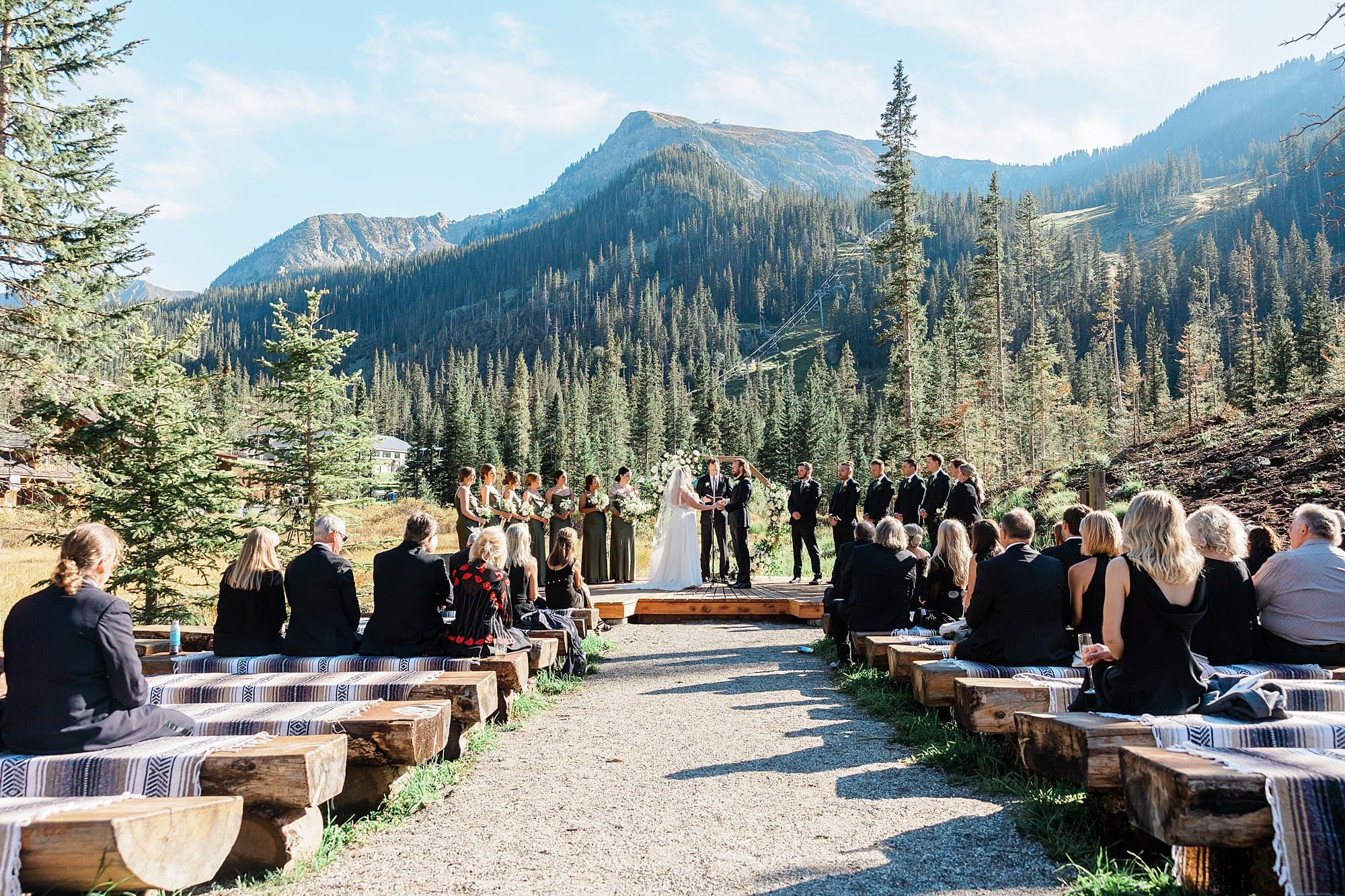 An intimate Taos Ski Valley wedding celebration occurs with a mountain view. 