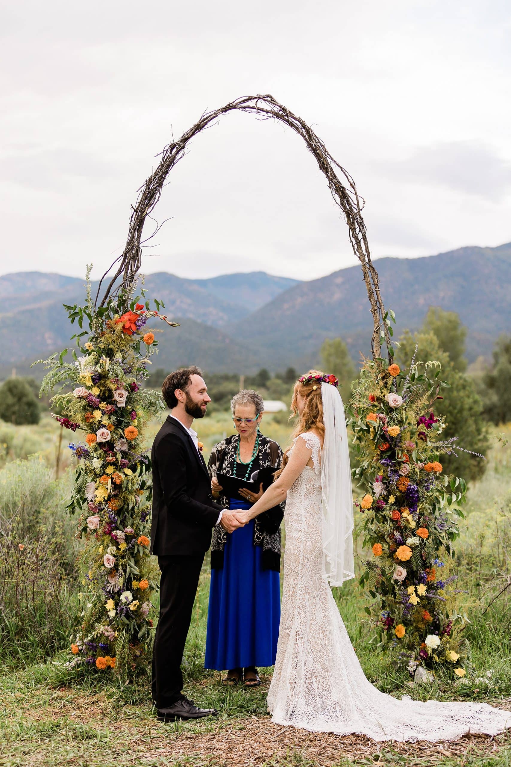 A bride and groom say their vows at a Goji Farm in Taos.