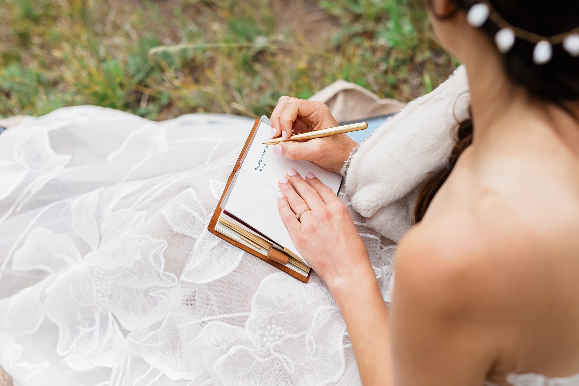 A bride writes vows before an elopement